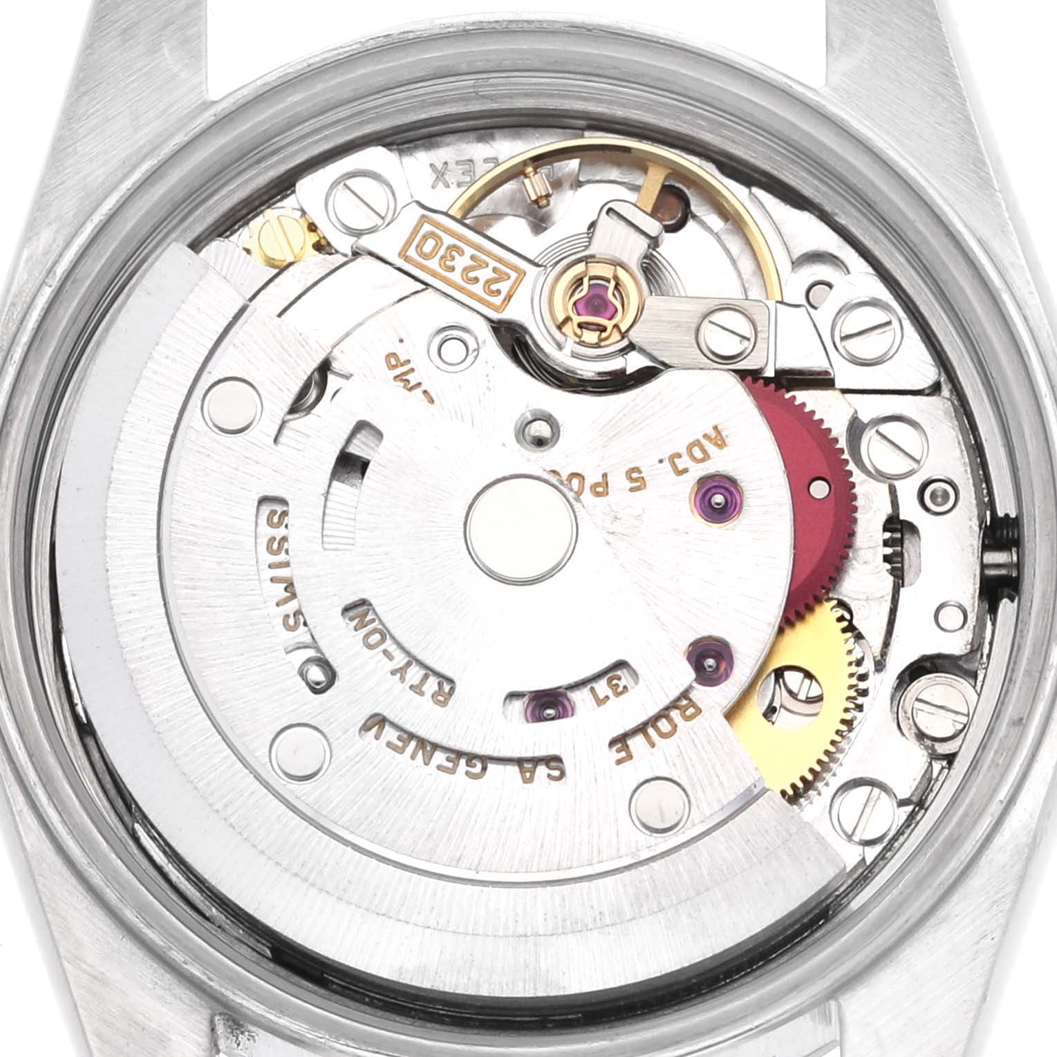 The image shows the movement of a Rolex Oyster Perpetual 76080 Women's Stainless Steel Pink Dial 76080 Women's Stainless Steel Pink Dial watch from the back, highlighting gears and mechanical components.