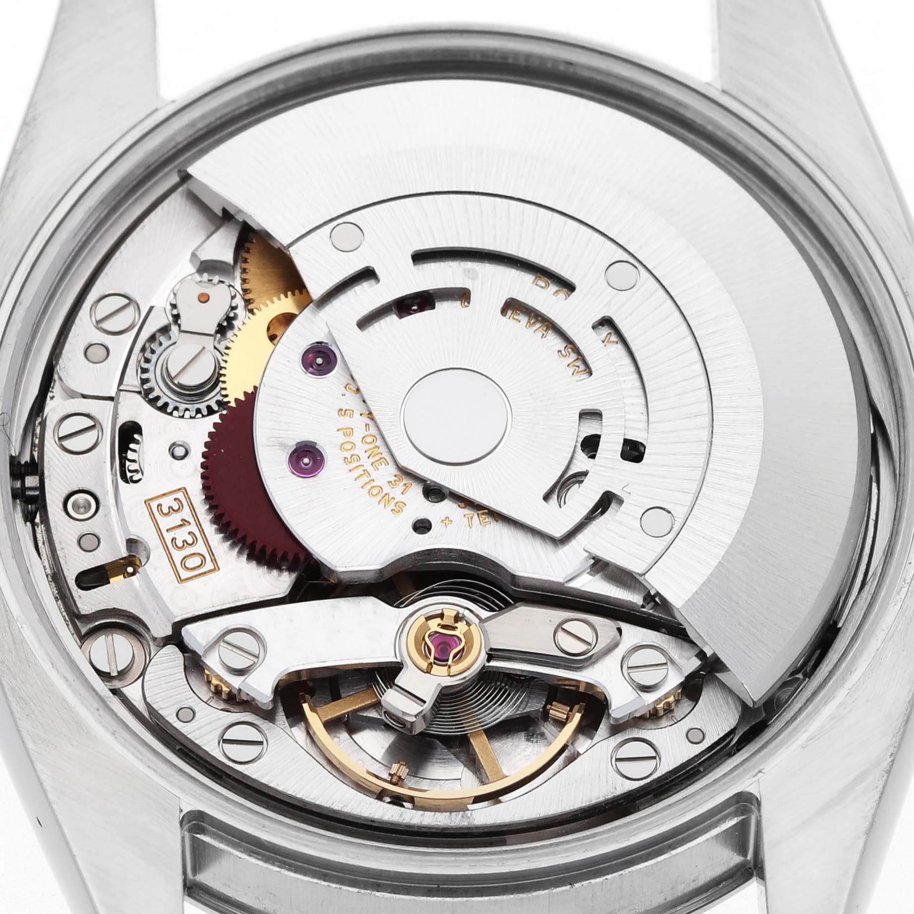 The image shows the movement mechanism of a Rolex Oyster Perpetual 114200 Men's Stainless Steel Silver Dial watch from a top-down angle.