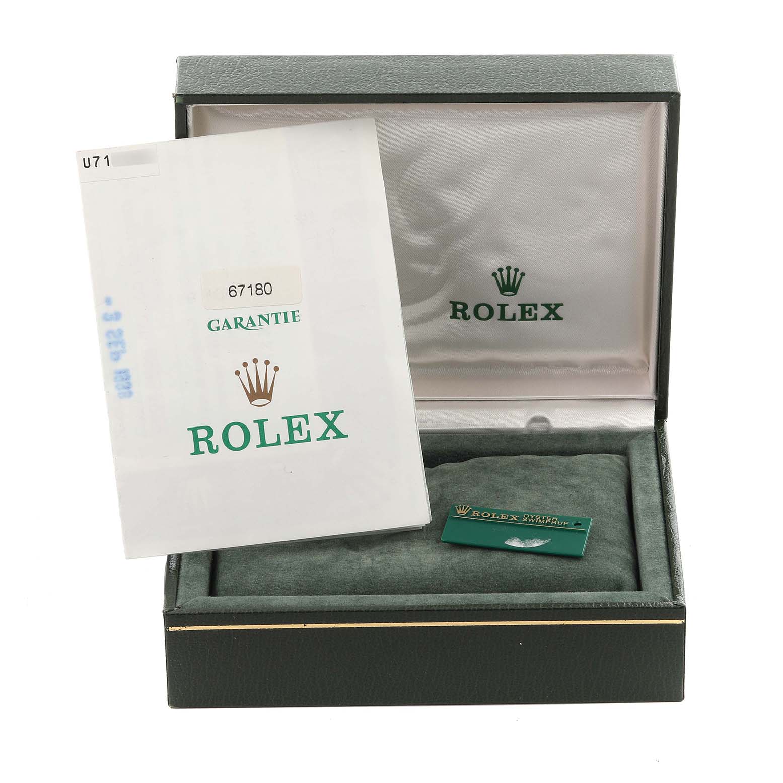 The image shows a green Rolex box for the Oyster Perpetual model, including a warranty card and booklet.