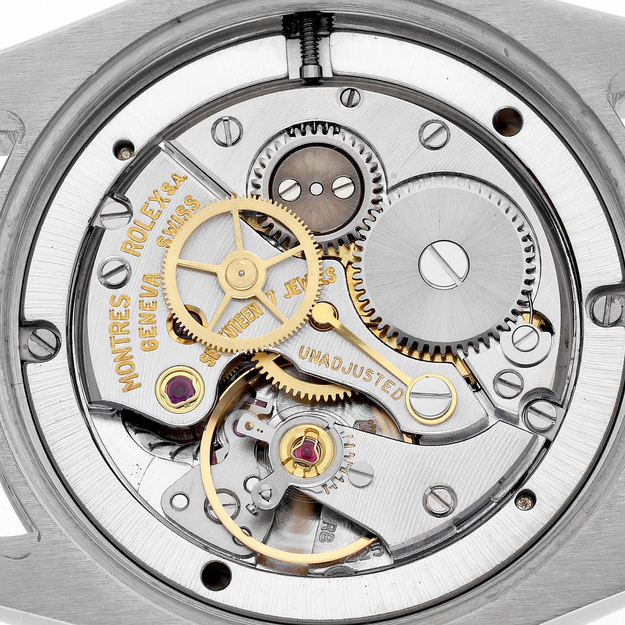The image shows the movement of a Rolex Date 6694 Men's Stainless Steel Silver Dial 6694 Men's Stainless Steel Silver Dial watch viewed from the back, highlighting gears and intricate components.