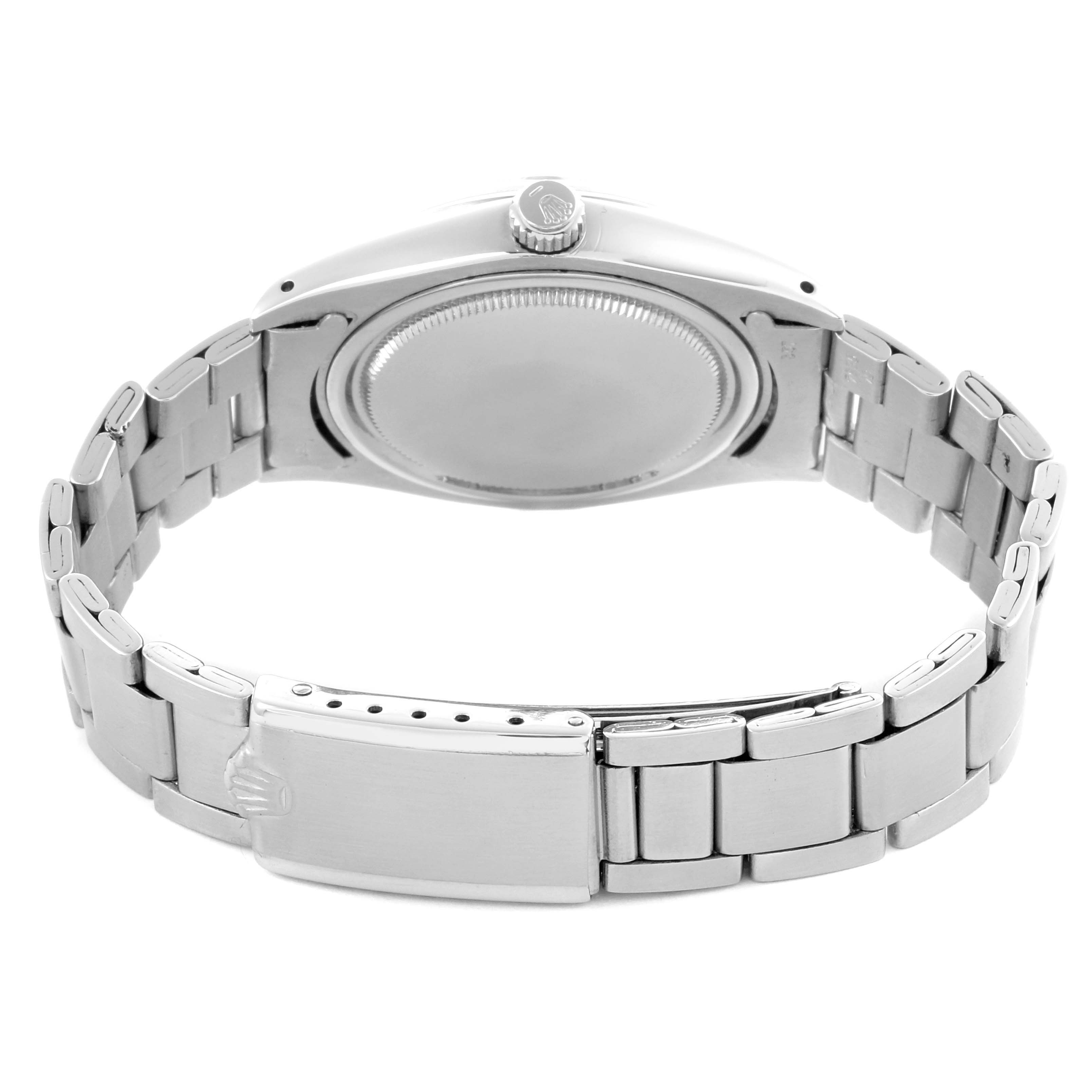 The image shows the Rolex Date 6694 Men's Stainless Steel Silver Dial 6694 Men's Stainless Steel Silver Dial watch from the back, highlighting the closed clasp and stainless steel bracelet.