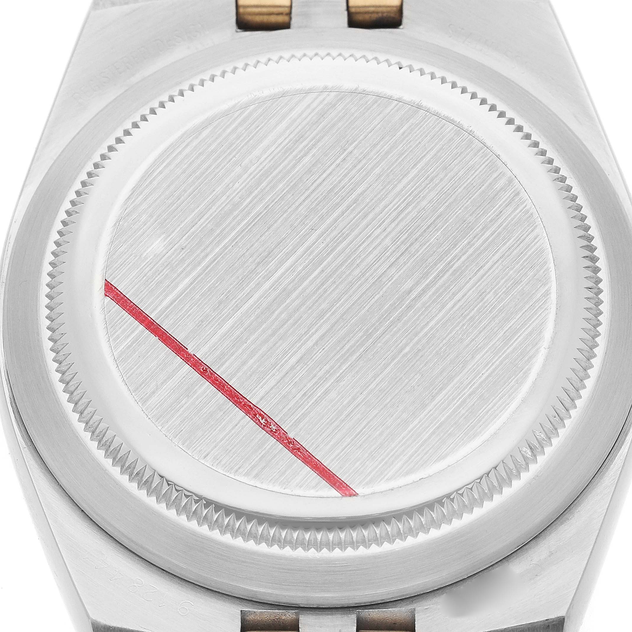 The image shows a close-up of the Rolex Oysterquartz 17013 Men's Steel and Gold (two tone) White Dial model's case back, highlighting the brushed finish and red seal.