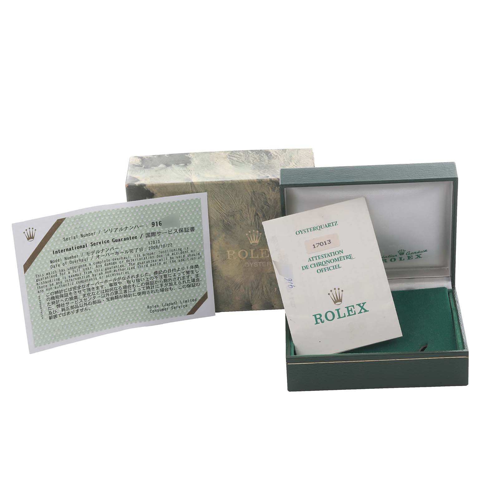 The image shows the Rolex Oysterquartz 17013 Men's Steel and Gold (two tone) White Dial 17013 Men's Steel and Gold (two tone) White Dial watch box, paperwork, and original packaging from a front angle.