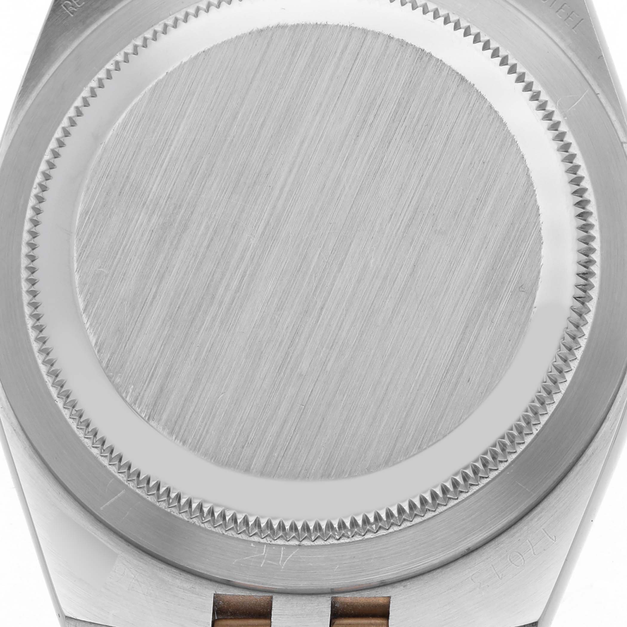 The image shows the back case of the Rolex Oysterquartz 17013 Men's Steel and Gold (two tone) White Dial 17013 Men's Steel and Gold (two tone) White Dial watch from a top view, highlighting the brushed metal finish and bezel.