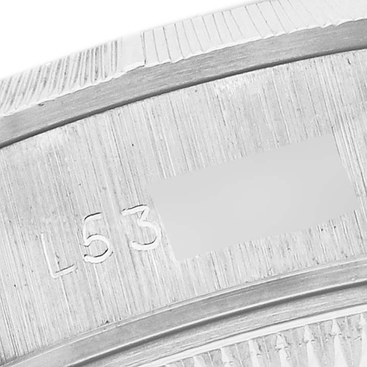 The image shows a close-up angle of the Rolex Pearlmaster's engraved inner case, highlighting its serial number.