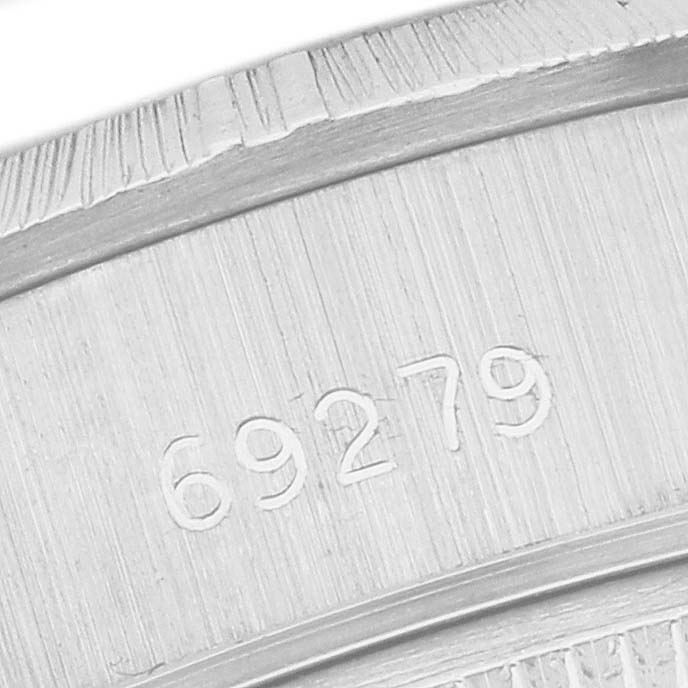 The image shows a close-up of the back casing of the Rolex Pearlmaster, focusing on the engraved serial number "69279."