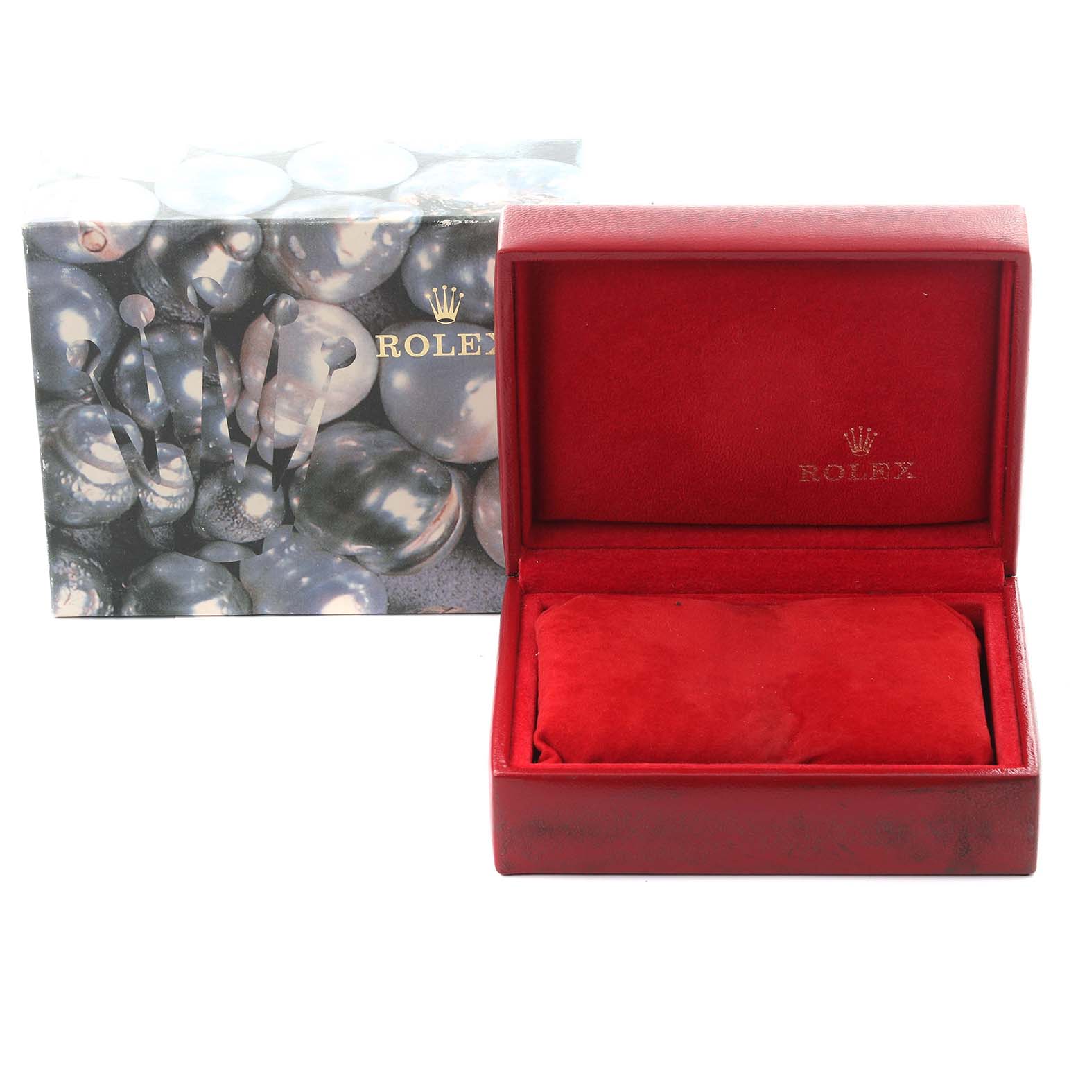The image shows a Rolex Pearlmaster watch box and packaging, including a red velvet interior and an outer sleeve with a pearl design.