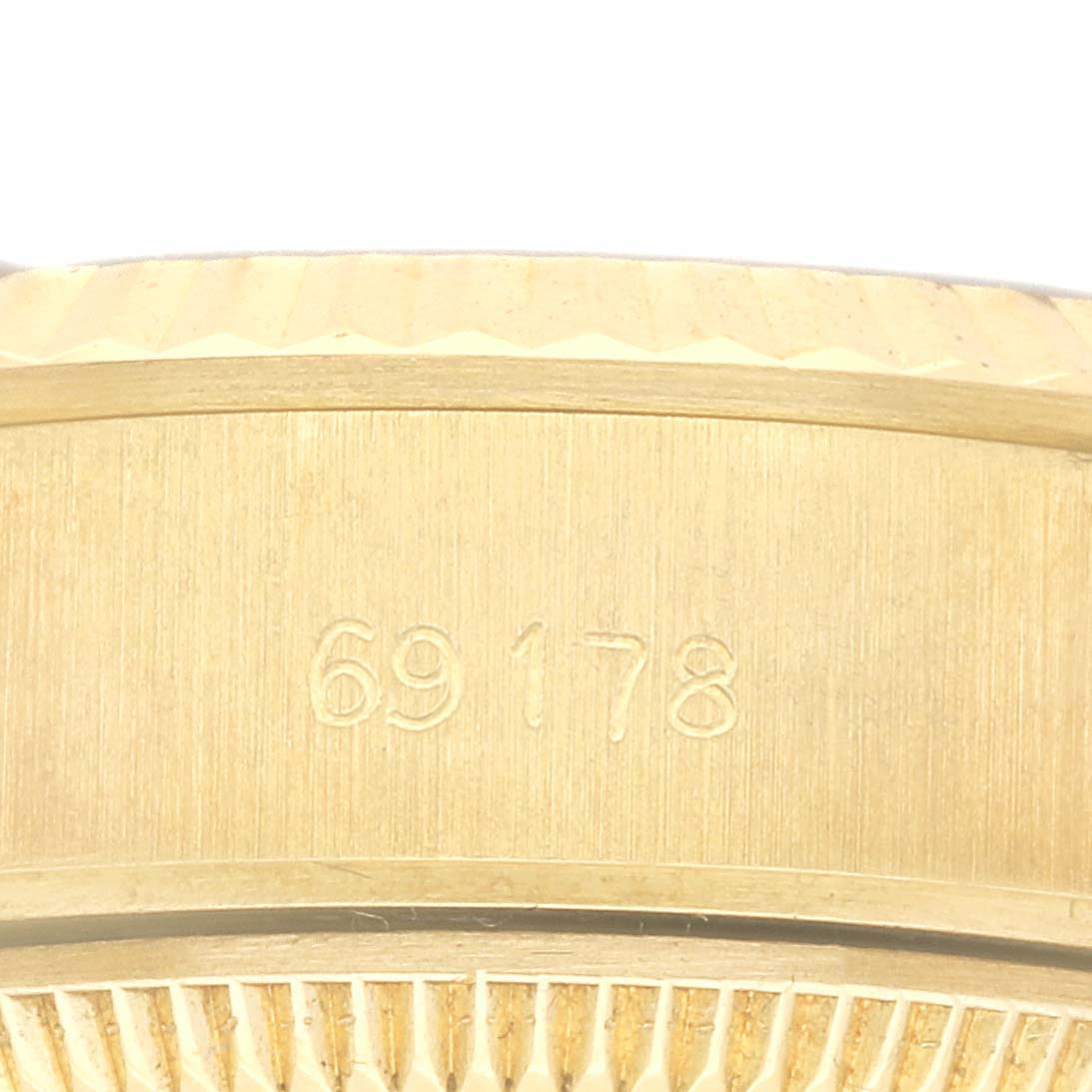 The image shows a close-up of the side of a Rolex President 69178 Women's Yellow Gold Champagne Dial 69178 Women's Yellow Gold Champagne Dial model, highlighting the model number engravings.