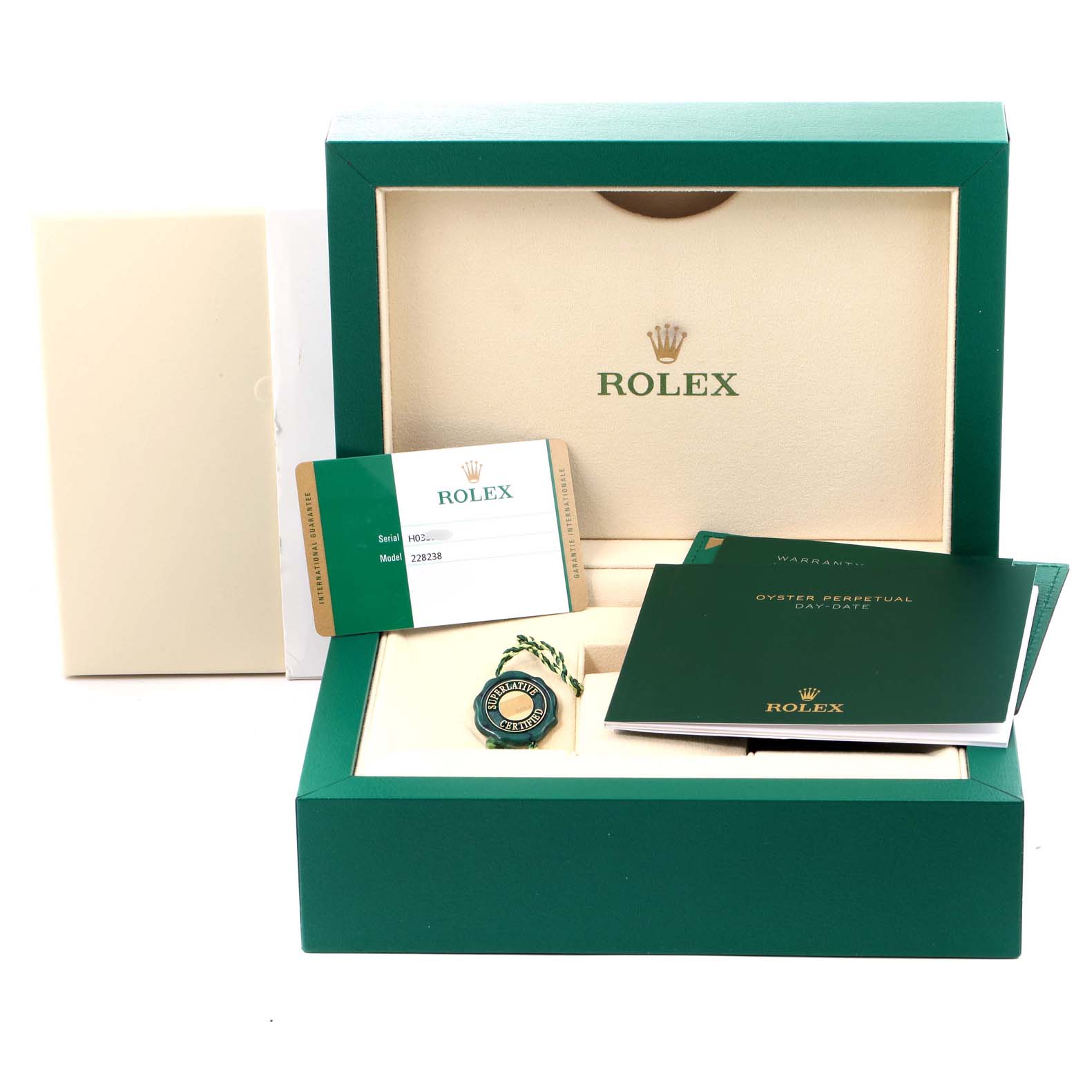 The image shows the packaging, warranty card, and booklets for a Rolex President 228238 Men's Yellow Gold White Dial 228238 Men's Yellow Gold White Dial model watch from a front angle.