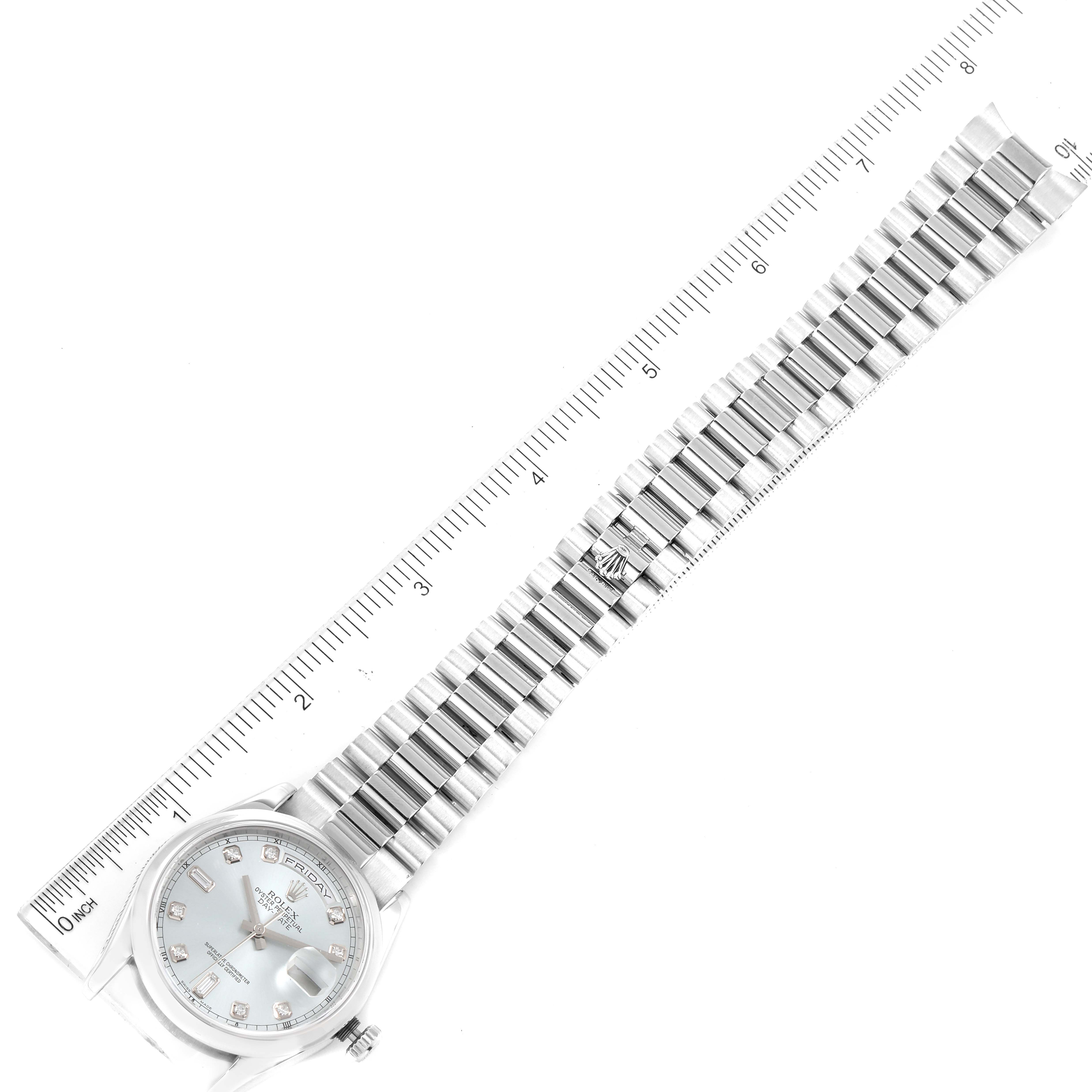 The image shows a Rolex President 118206 Men's Platinum Blue Dial 118206 Men's Platinum Blue Dial model watch laid flat with a full view of its face and band, alongside a ruler for scale.