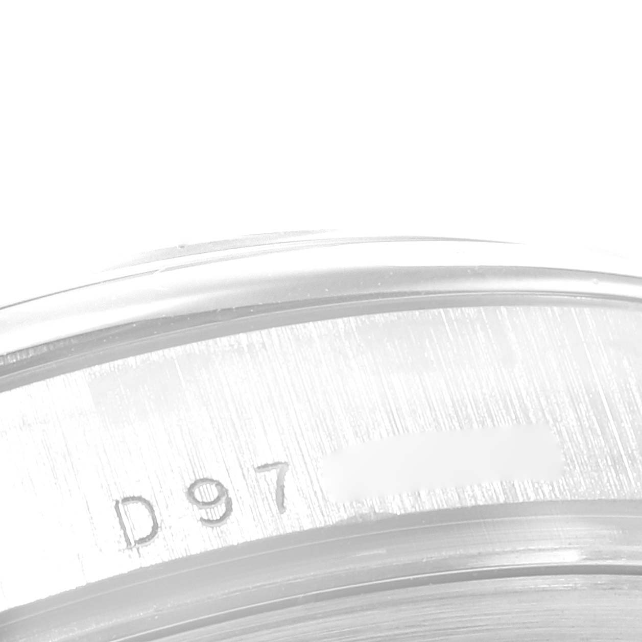 This image shows a close-up view of the serial number engraved on the inner bezel of a Rolex President 118206 Men's Platinum Blue Dial 118206 Men's Platinum Blue Dial model watch.