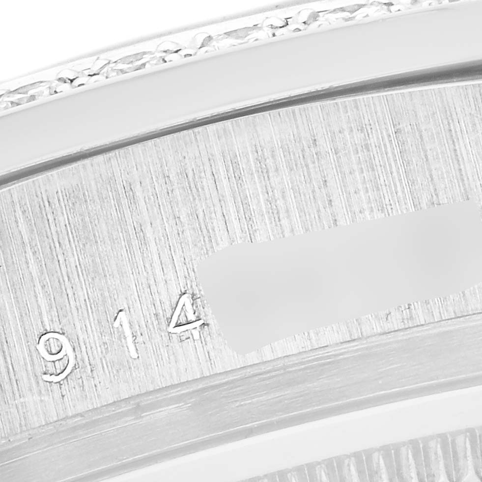 The image shows a close-up angle of the Rolex President 18049 Men's White Gold Silver Dial 18049 Men's White Gold Silver Dial model's inner watch case, highlighting the serial number engraving.