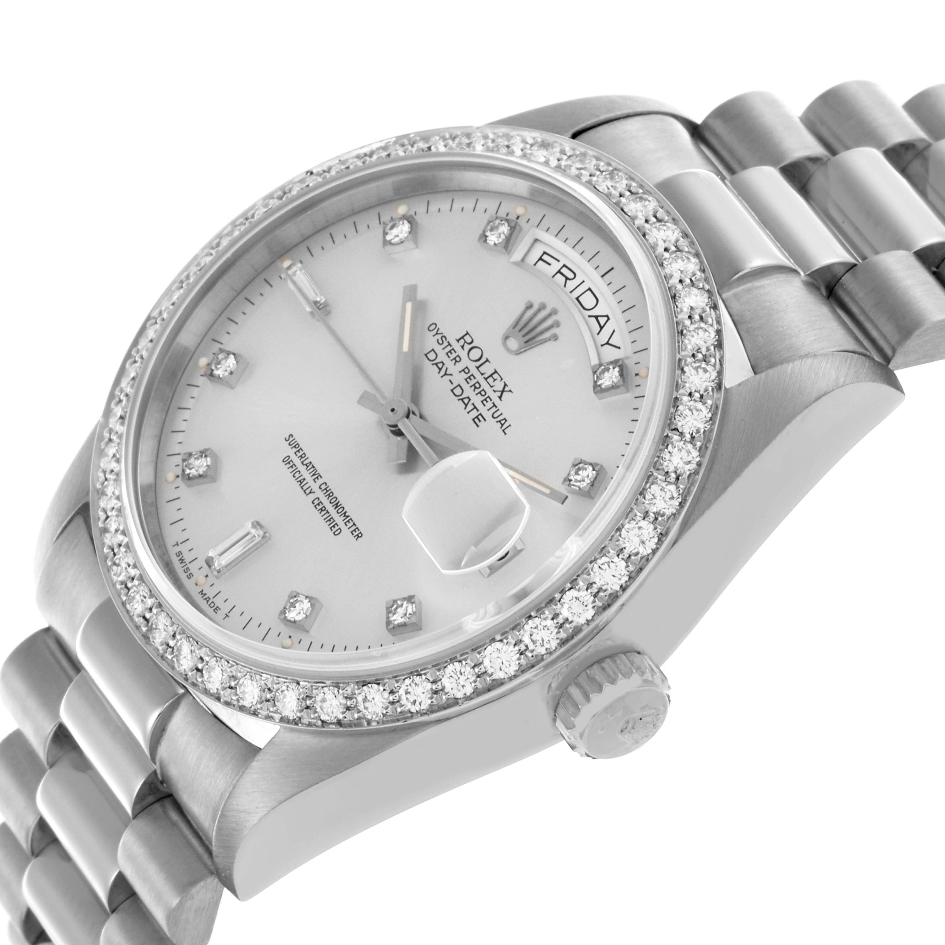 The Rolex President 18049 Men's White Gold Silver Dial 18049 Men's White Gold Silver Dial watch is shown at an angled view, highlighting the diamond bezel, face, and part of the bracelet.