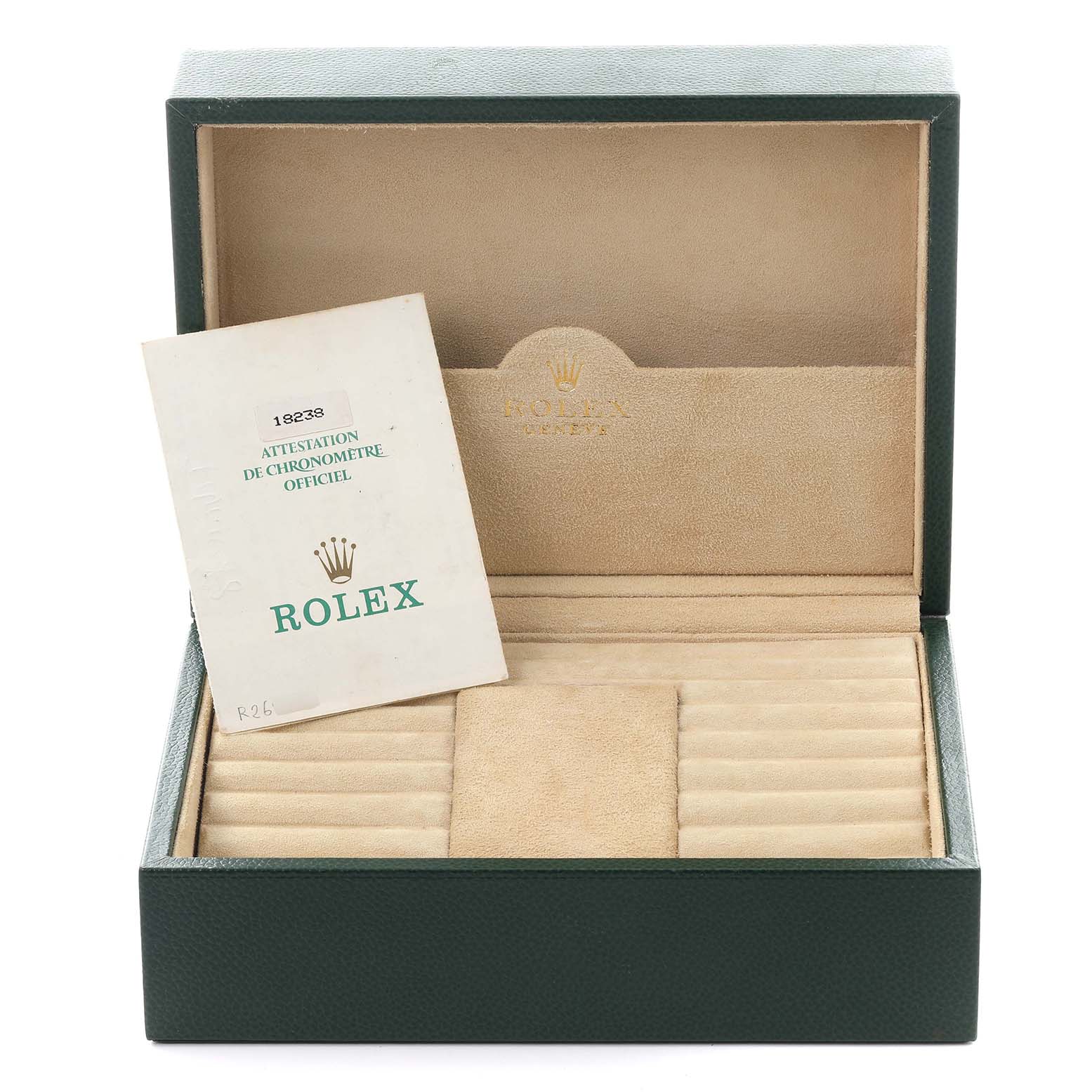 The image shows an open Rolex box for the President model, revealing a certification booklet inside.