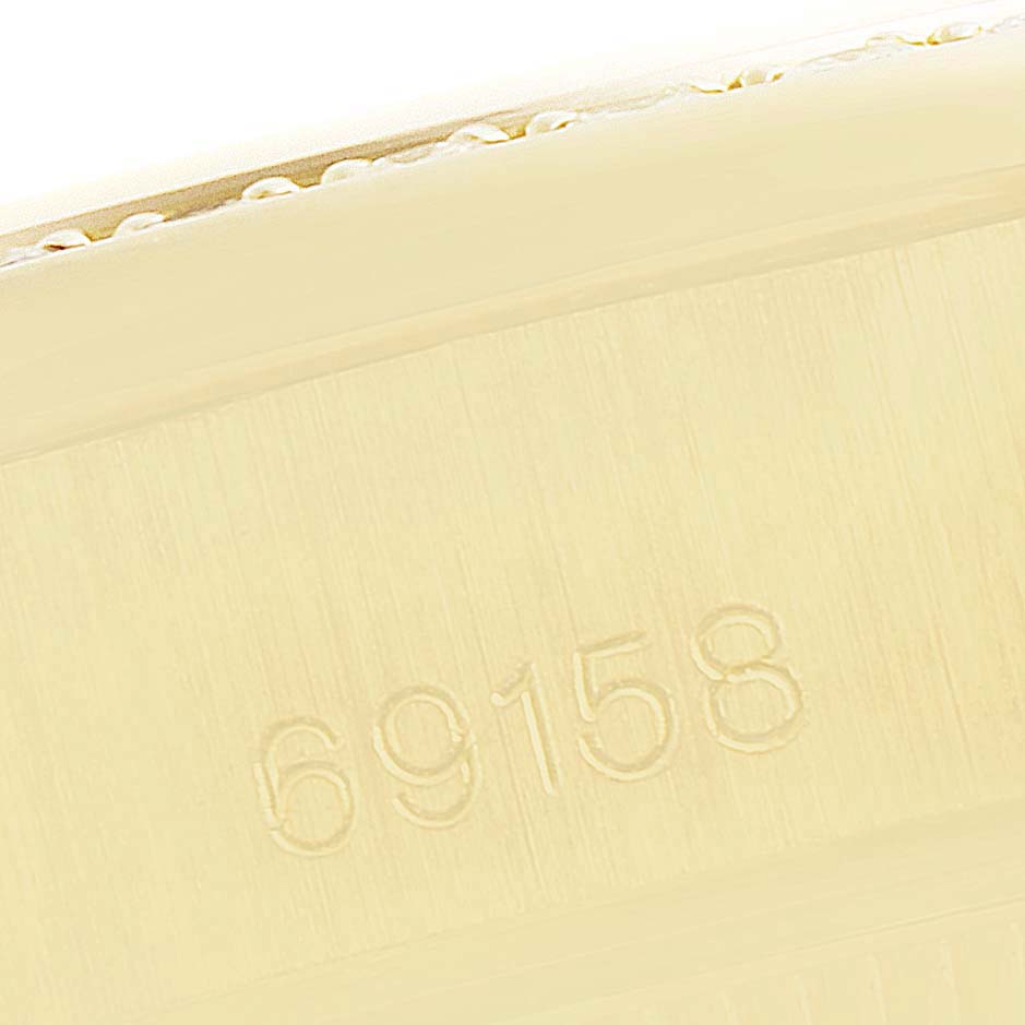 The image shows a close-up of the case side of a Rolex President 69158 Women's Yellow Gold Grey Dial 69158 Women's Yellow Gold Grey Dial model, displaying the reference number "69158."