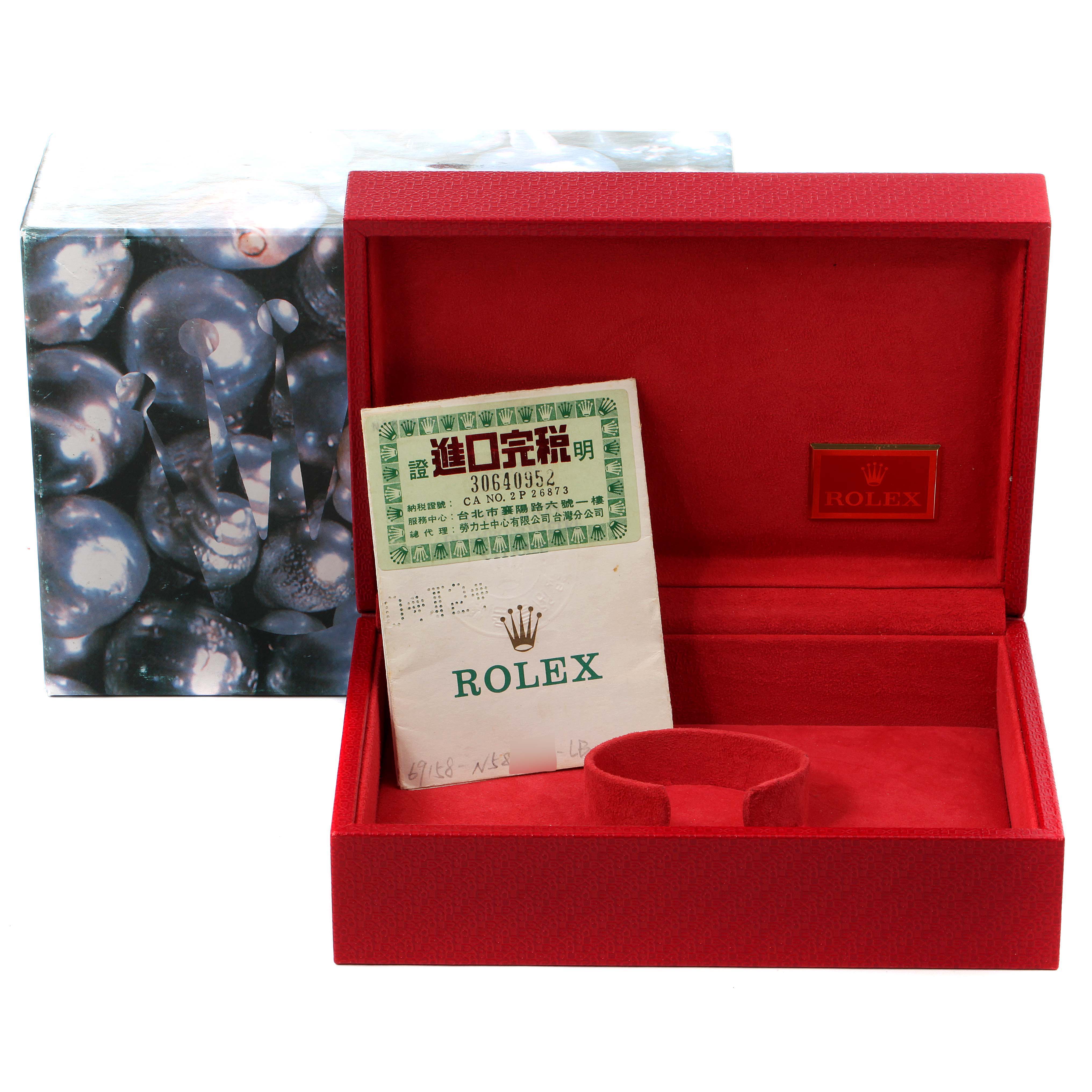 The image shows a box for the Rolex President 69158 Women's Yellow Gold Grey Dial 69158 Women's Yellow Gold Grey Dial model watch, containing warranty documents.