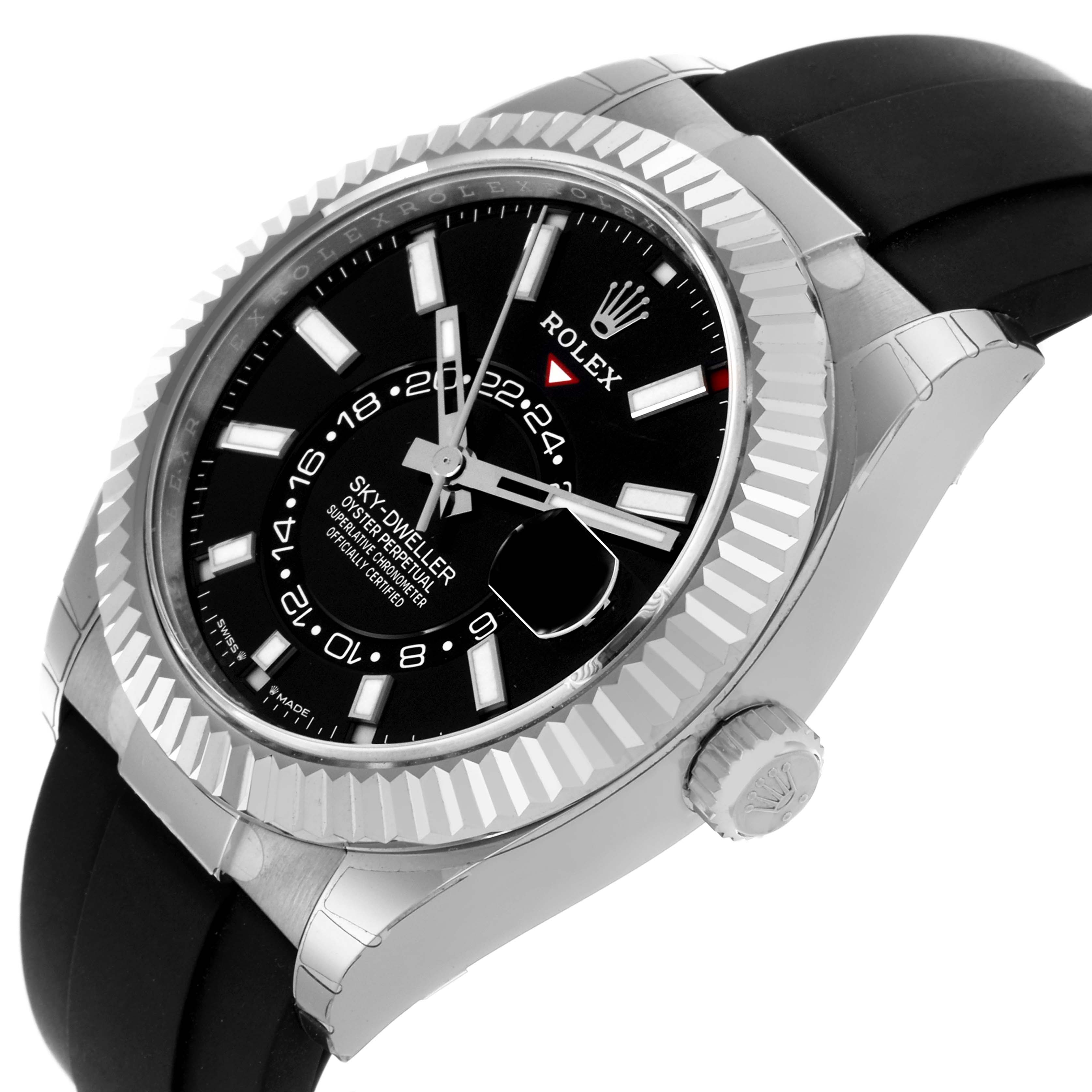 The Rolex Sky-Dweller 336239-0002 Men's White Gold Black Dial 336239-0002 Men's White Gold Black Dial watch is shown at an angled top-down view, highlighting its bezel, dial, hands, and black strap.