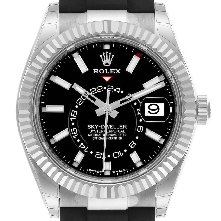 The Rolex Sky-Dweller watch is shown from a front angle, displaying its black dial, fluted bezel, and date window.