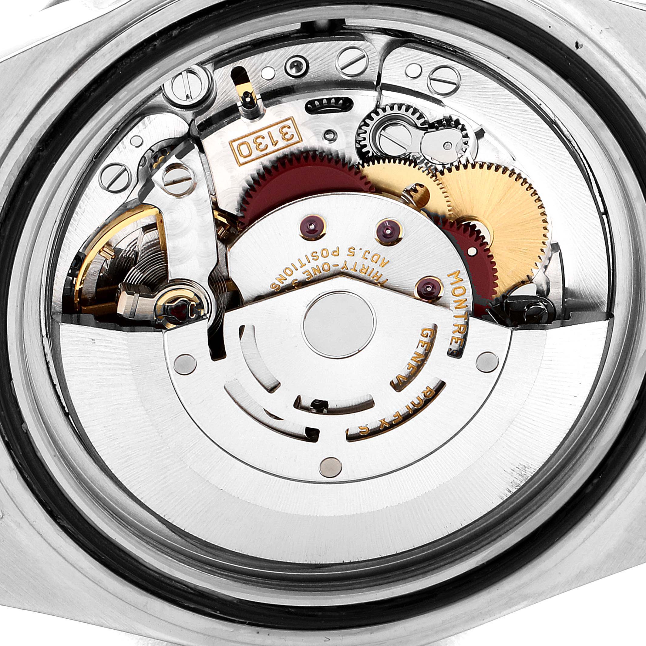 This is a close-up view of the internal movement mechanism of a Rolex Submariner 14060M Men
s Stainless Steel Black Dial 14060M Men
s Stainless Steel Black Dial watch.