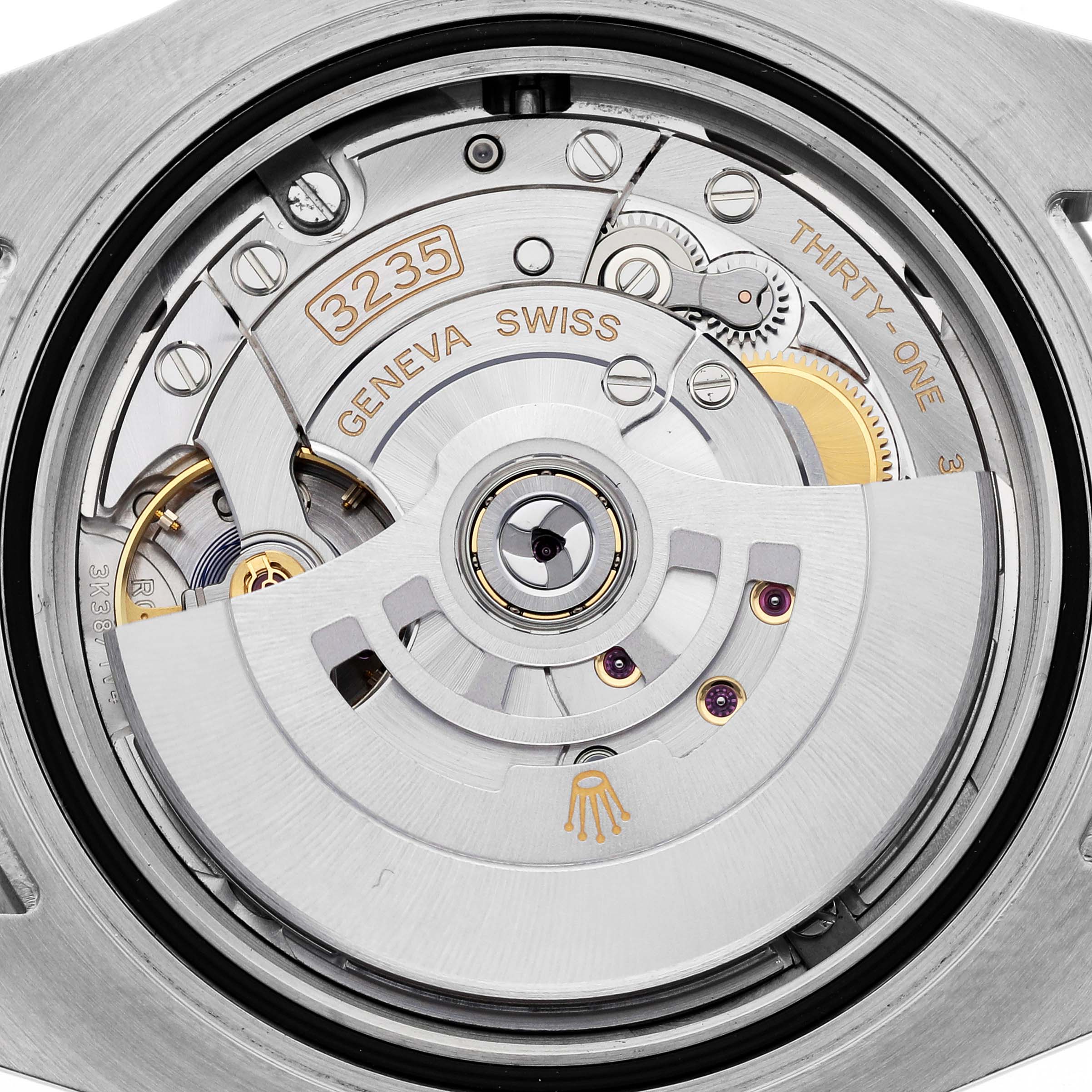 The image shows the movement of a Rolex Submariner 126613 Men's Steel and Gold (two tone) Black Dial 126613 Men's Steel and Gold (two tone) Black Dial watch, highlighting its intricate internal mechanics.