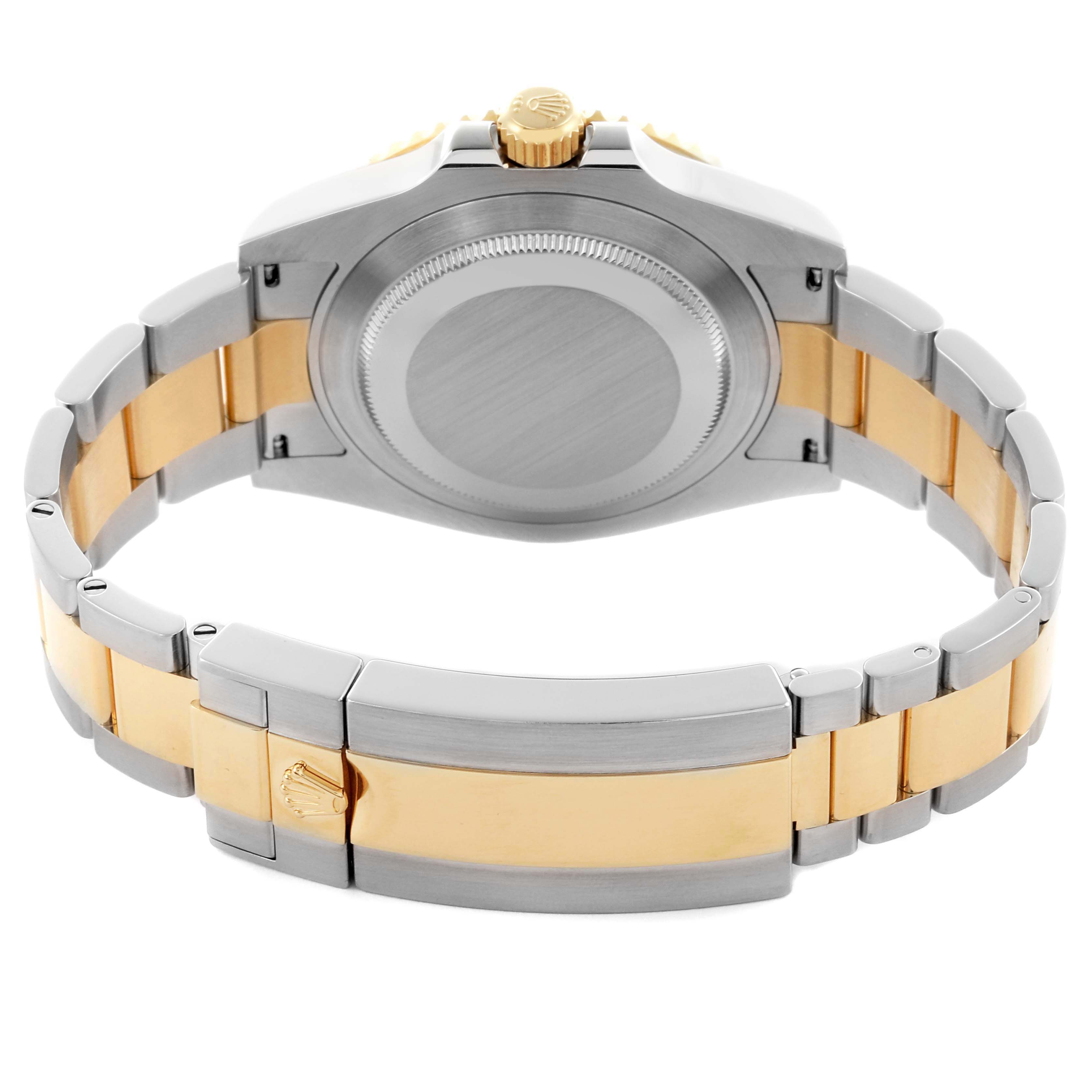 The image shows a rear view of the Rolex Submariner 126613 Men's Steel and Gold (two tone) Black Dial 126613 Men's Steel and Gold (two tone) Black Dial, highlighting the case back, crown, and two-tone bracelet.