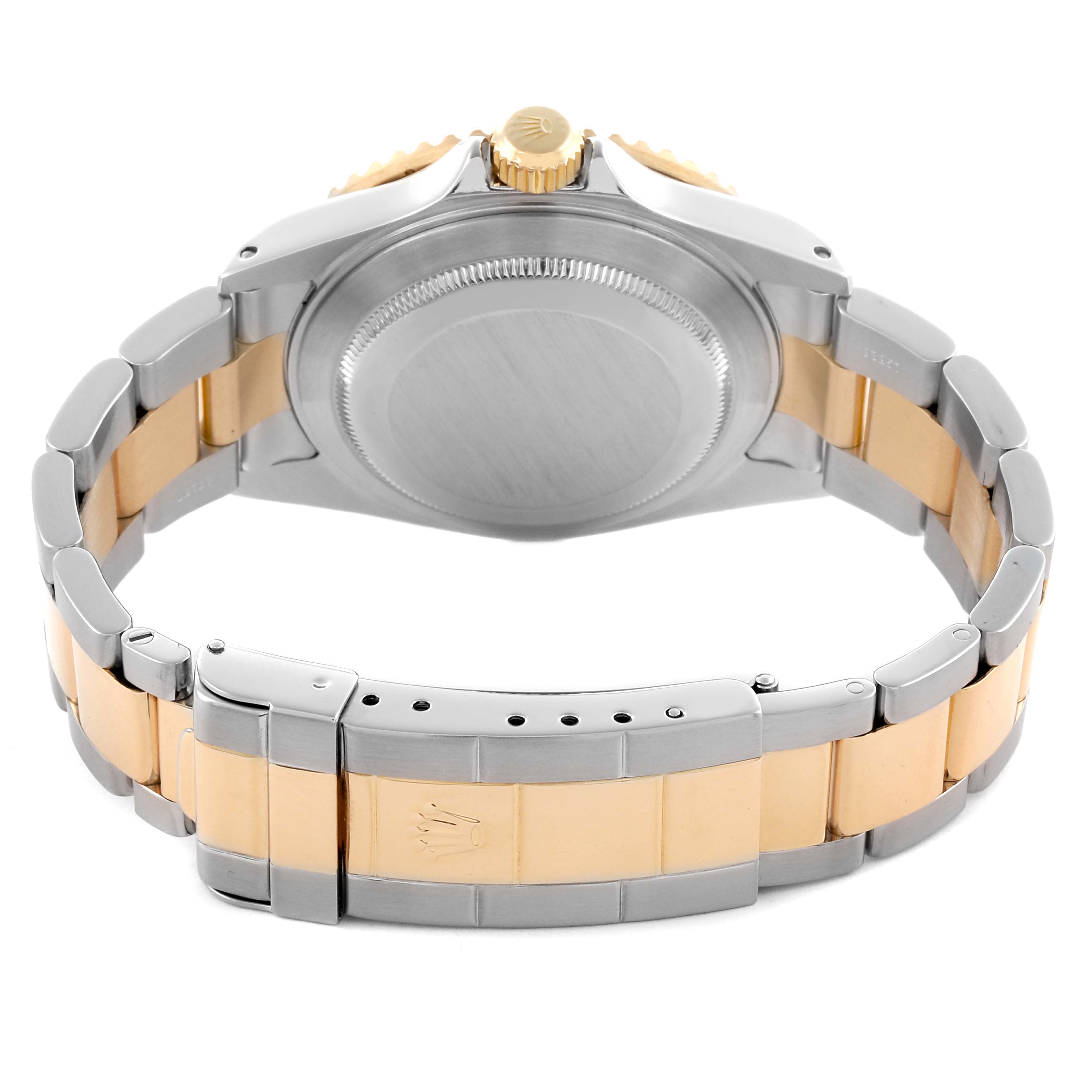 The image shows the back of a Rolex Submariner 16613 Men's Steel and Gold (two tone) Black Dial 16613 Men's Steel and Gold (two tone) Black Dial, highlighting the case back, crown, and two-tone bracelet.