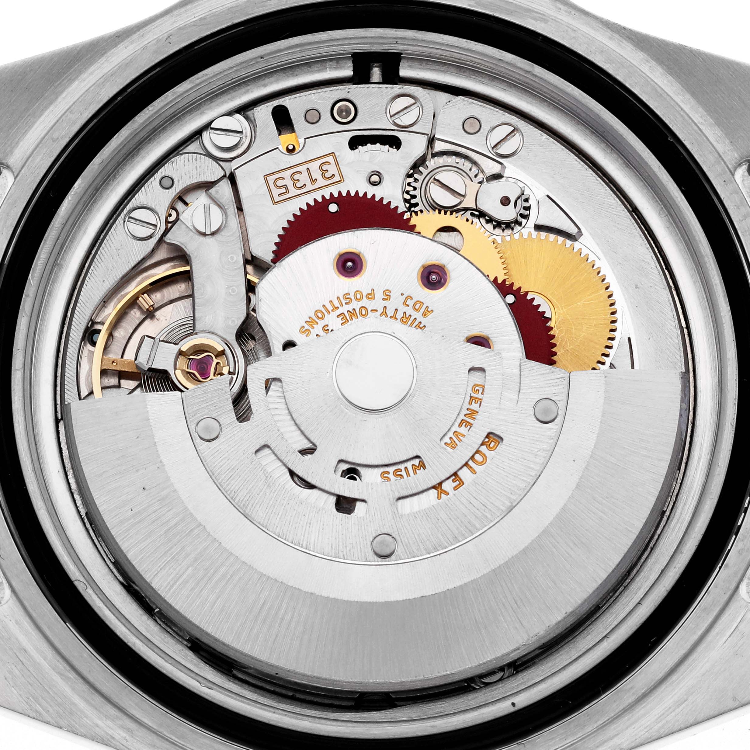 The image shows the movement of a Rolex Submariner 16613 Men's Steel and Gold (two tone) Blue Dial 16613 Men's Steel and Gold (two tone) Blue Dial watch from a top-down angle, highlighting its gears and rotor.