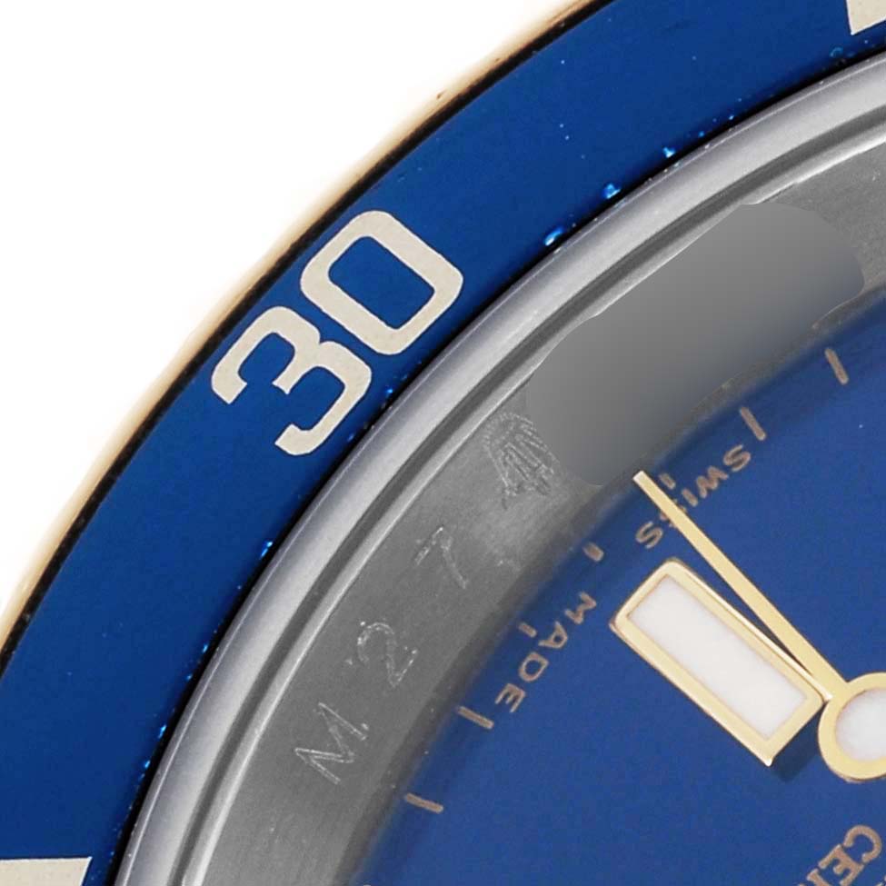 This image shows a close-up of the bezel and dial of a Rolex Submariner 16613 Men's Steel and Gold (two tone) Blue Dial 16613 Men's Steel and Gold (two tone) Blue Dial, focusing on the "30" minute marker and part of the watch face.
