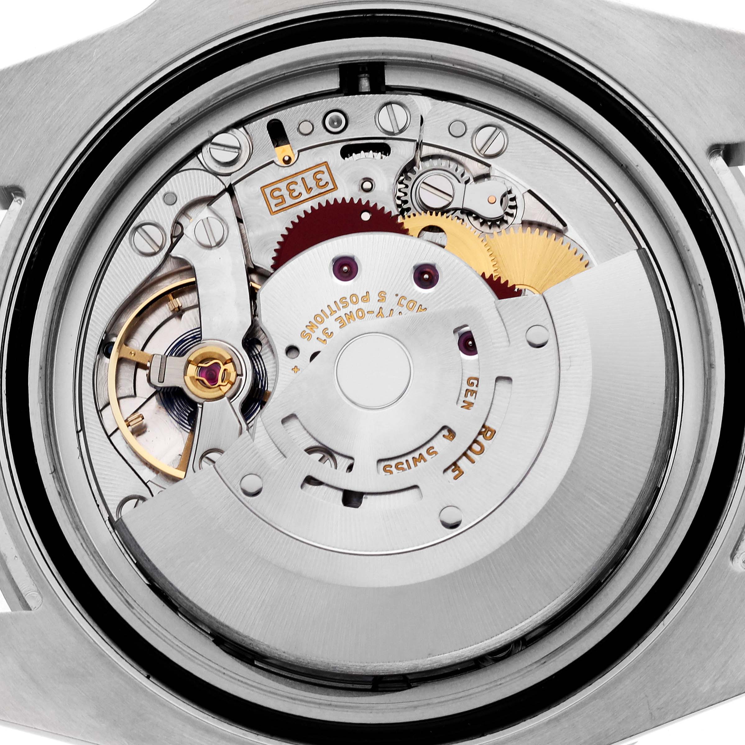 The image shows the internal movement of a Rolex Submariner 116610LN Men's Stainless Steel Black Dial 116610LN Men's Stainless Steel Black Dial watch from a top-down angle, highlighting gears and mechanisms.