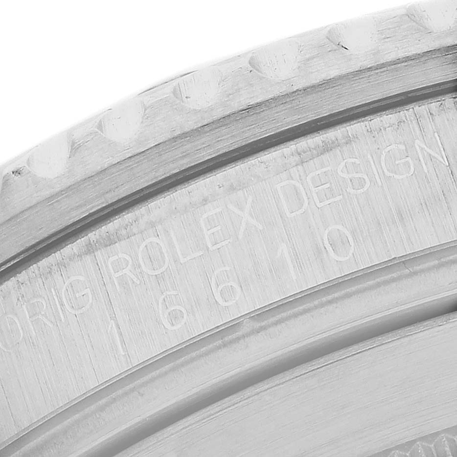 The image shows a close-up of the case engraving on a Rolex Submariner 16610 Men's Stainless Steel Black Dial, highlighting the model number "16610."