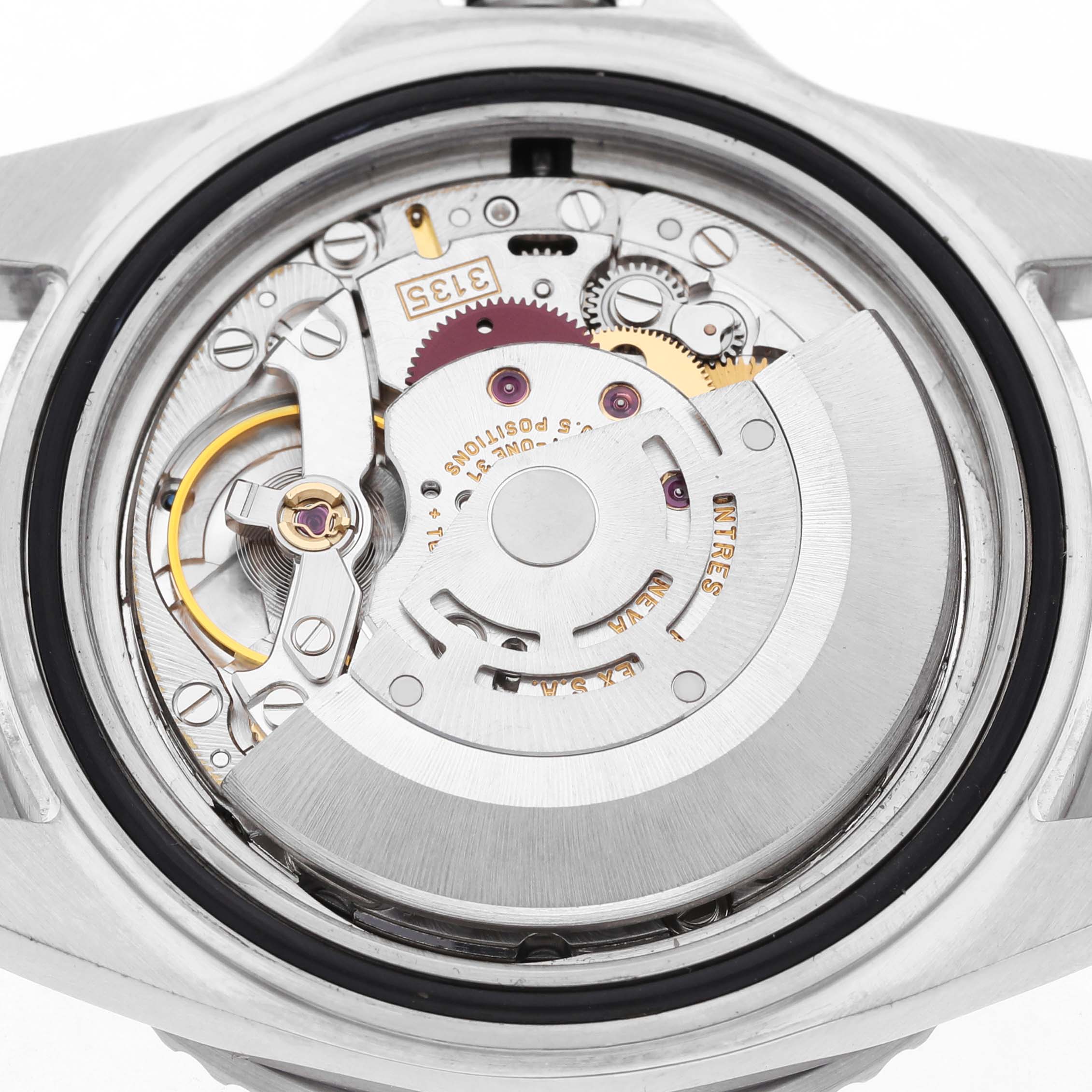 The image shows the open case back of a Rolex Submariner 16610 Men's Stainless Steel Black Dial, revealing its intricate movement and internal components.