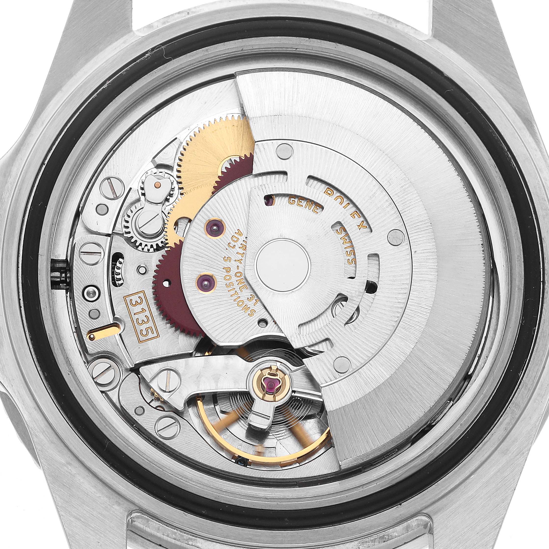 The image shows the back view of a Rolex Submariner 16610 Men's Stainless Steel Black Dial, focusing on its intricate movement and gear components.