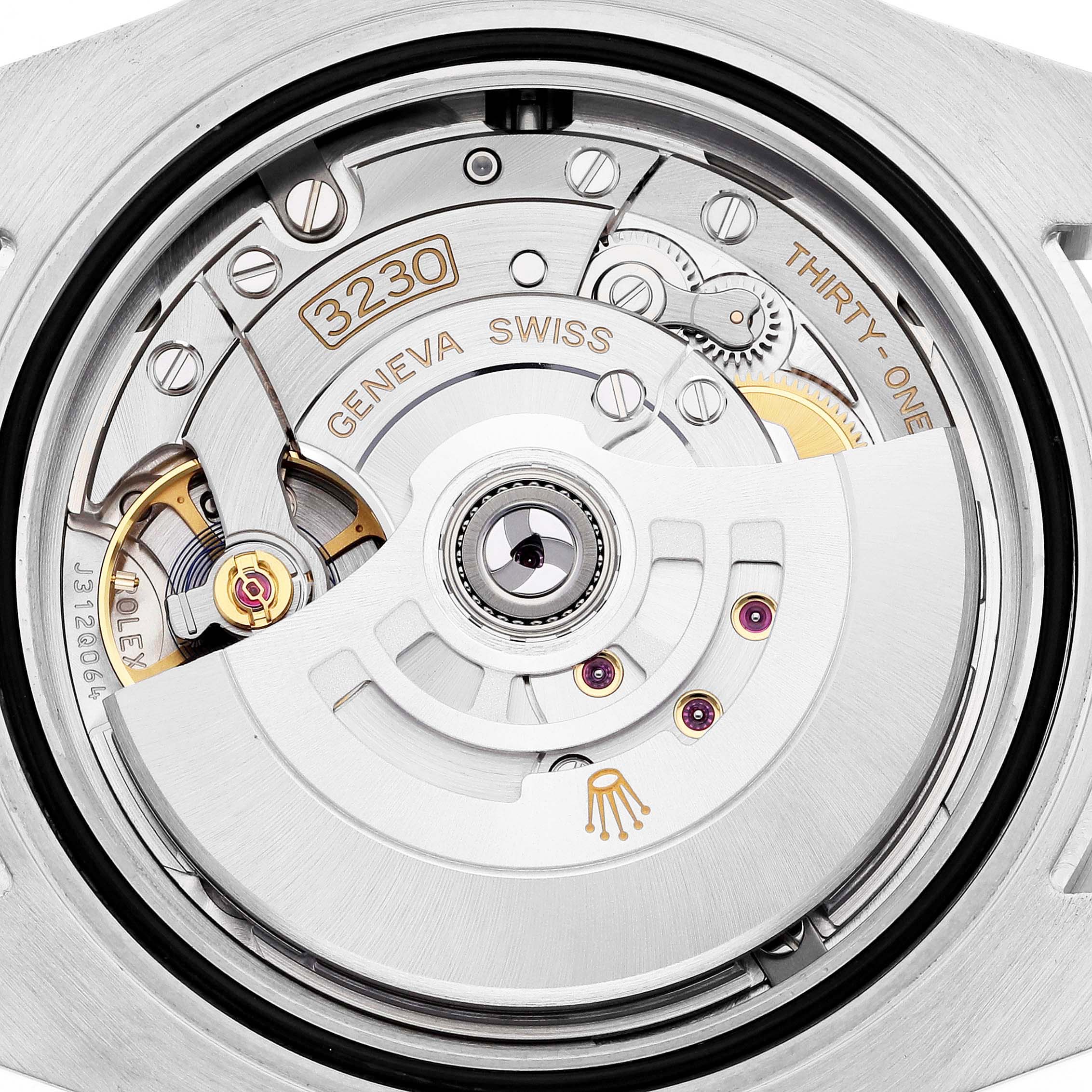 This image shows the movement of a Rolex Submariner 124060 Men's Stainless Steel Black Dial 124060 Men's Stainless Steel Black Dial watch from the back, highlighting gears, jewels, and the rotor.