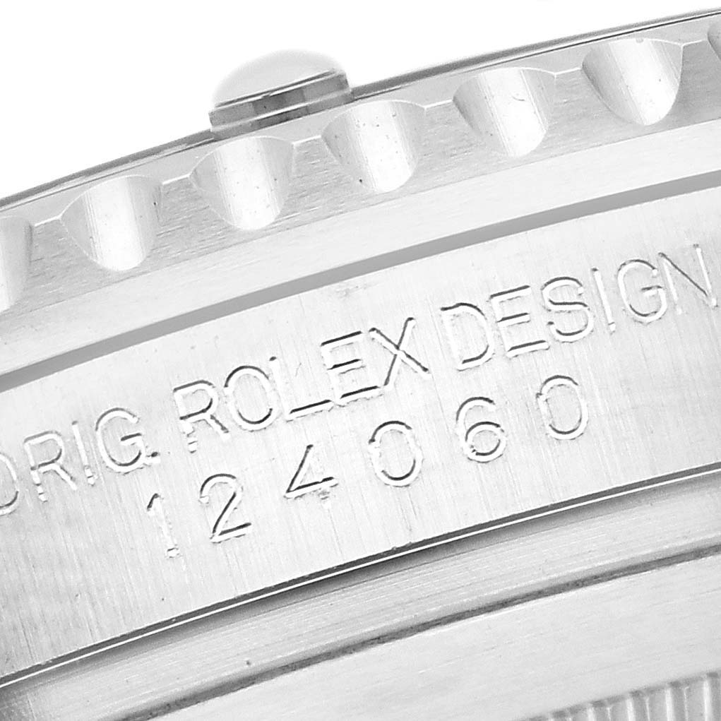 The image shows a close-up of the side and bezel edge of a Rolex Submariner 124060 Men's Stainless Steel Black Dial 124060 Men's Stainless Steel Black Dial, displaying the engraved model number.