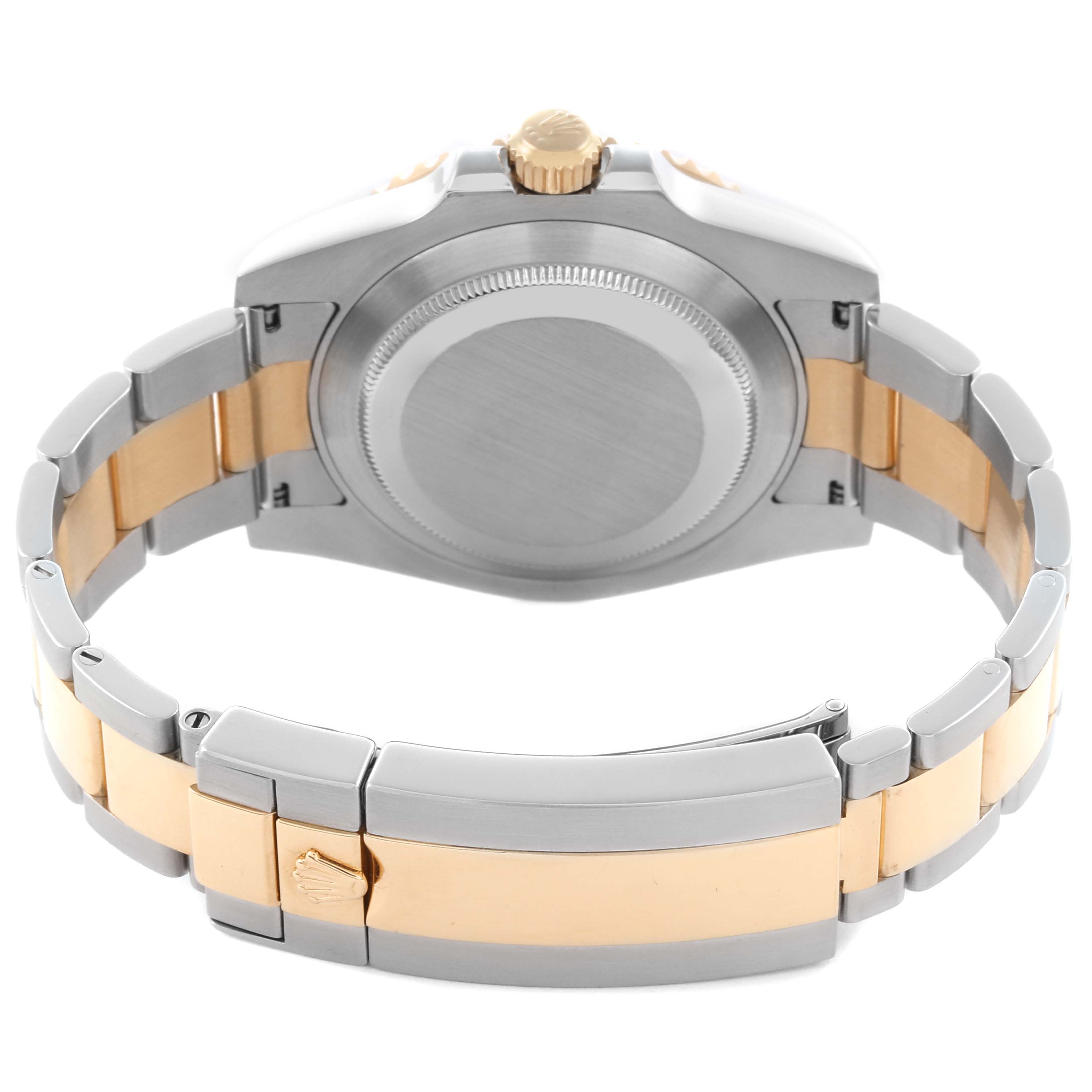 The image shows the back case and bracelet of a Rolex Submariner 116613 Men's Steel and Gold (two tone) Black Dial 116613 Men's Steel and Gold (two tone) Black Dial, highlighting its two-tone metal finish.