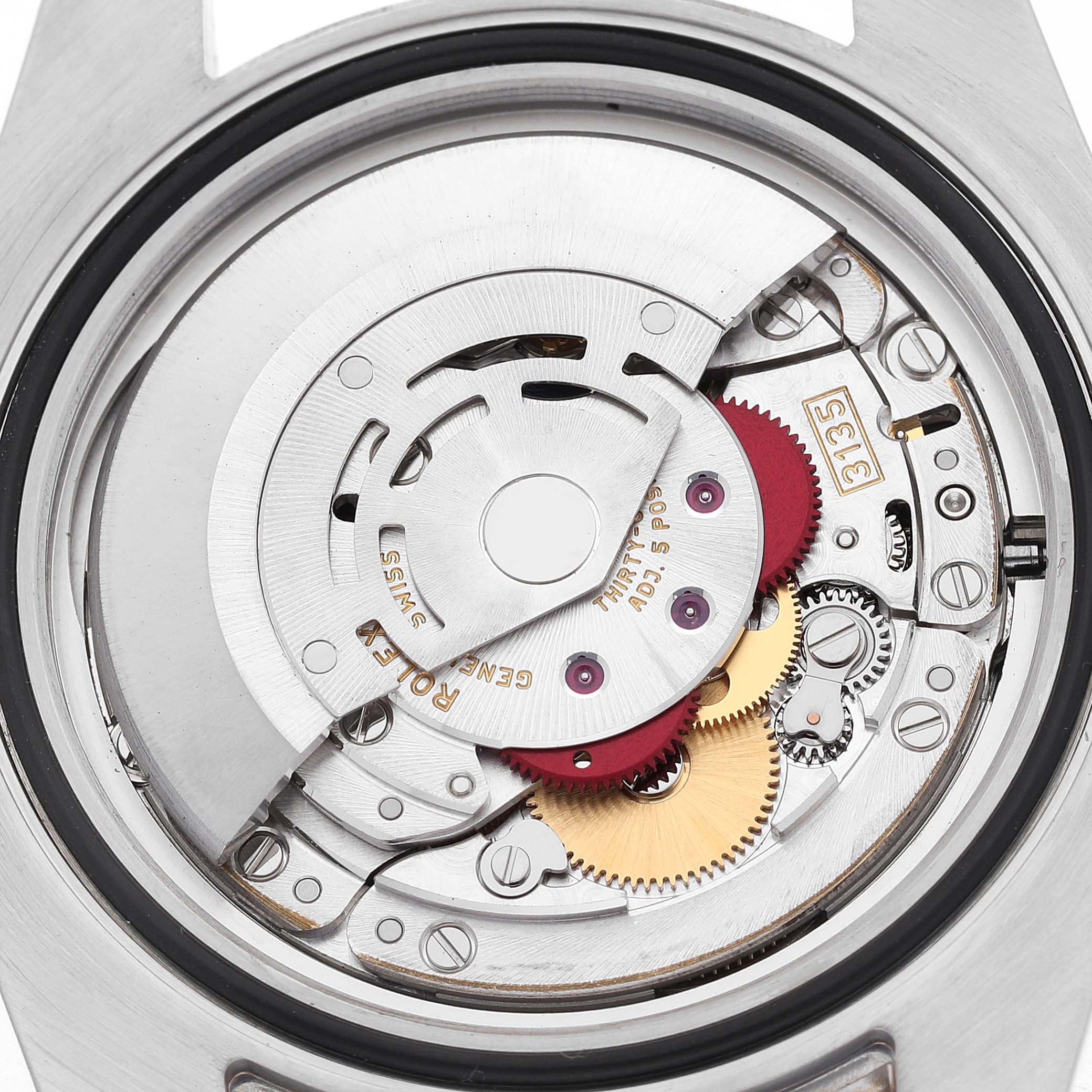 The image shows the Rolex Submariner 116613 Men's Steel and Gold (two tone) Black Dial's movement from the back, highlighting gears and components of its mechanical inner workings.