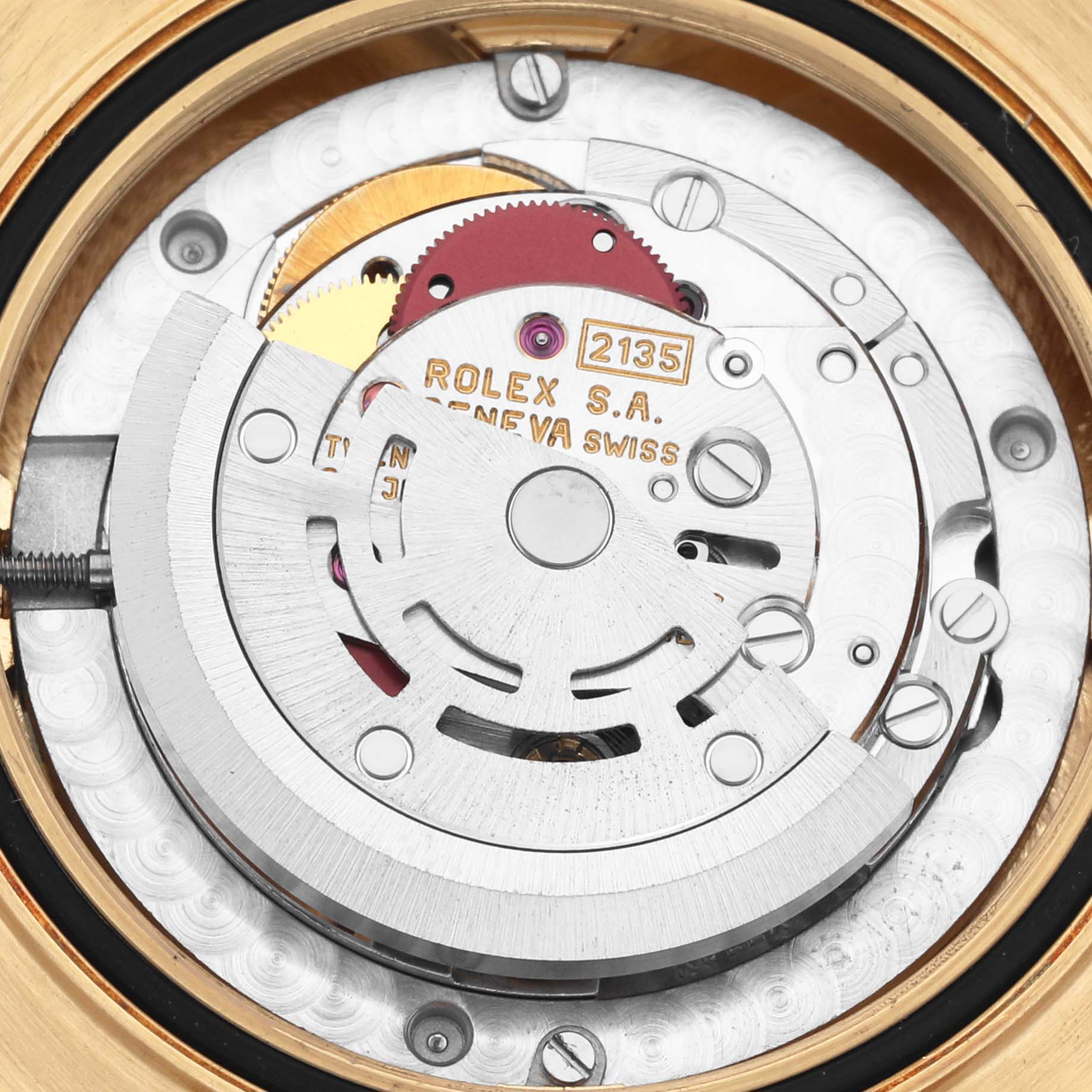 This image shows the movement of a Rolex Mid-Size watch, focusing on the rotor and inner components.