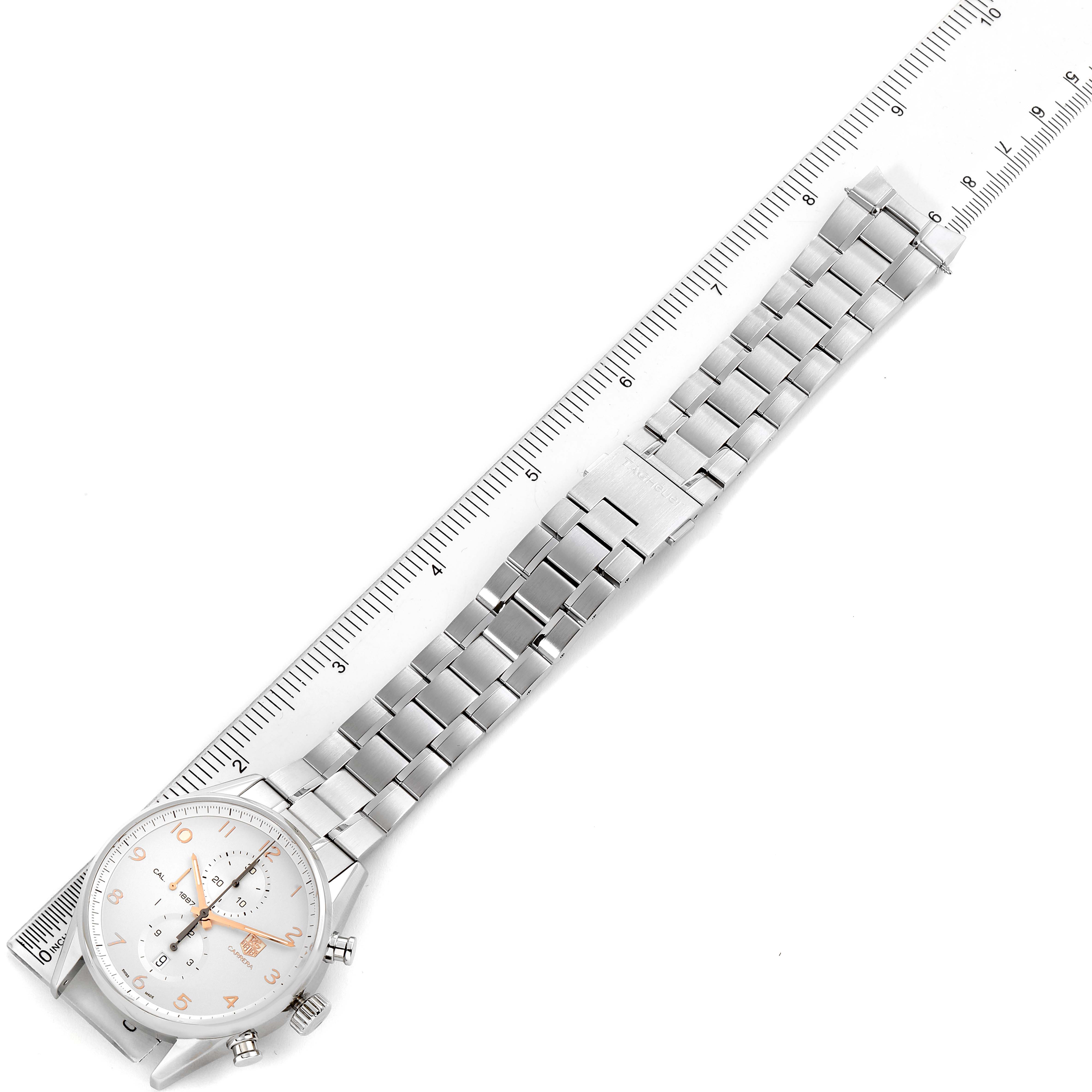 The image shows the full length of a Tag Heuer Carrera CAR2012.BA0796 Men
s Stainless Steel Silver Dial CAR2012.BA0796 Men
s Stainless Steel Silver Dial watch, including its face and stainless steel band, next to a ruler.