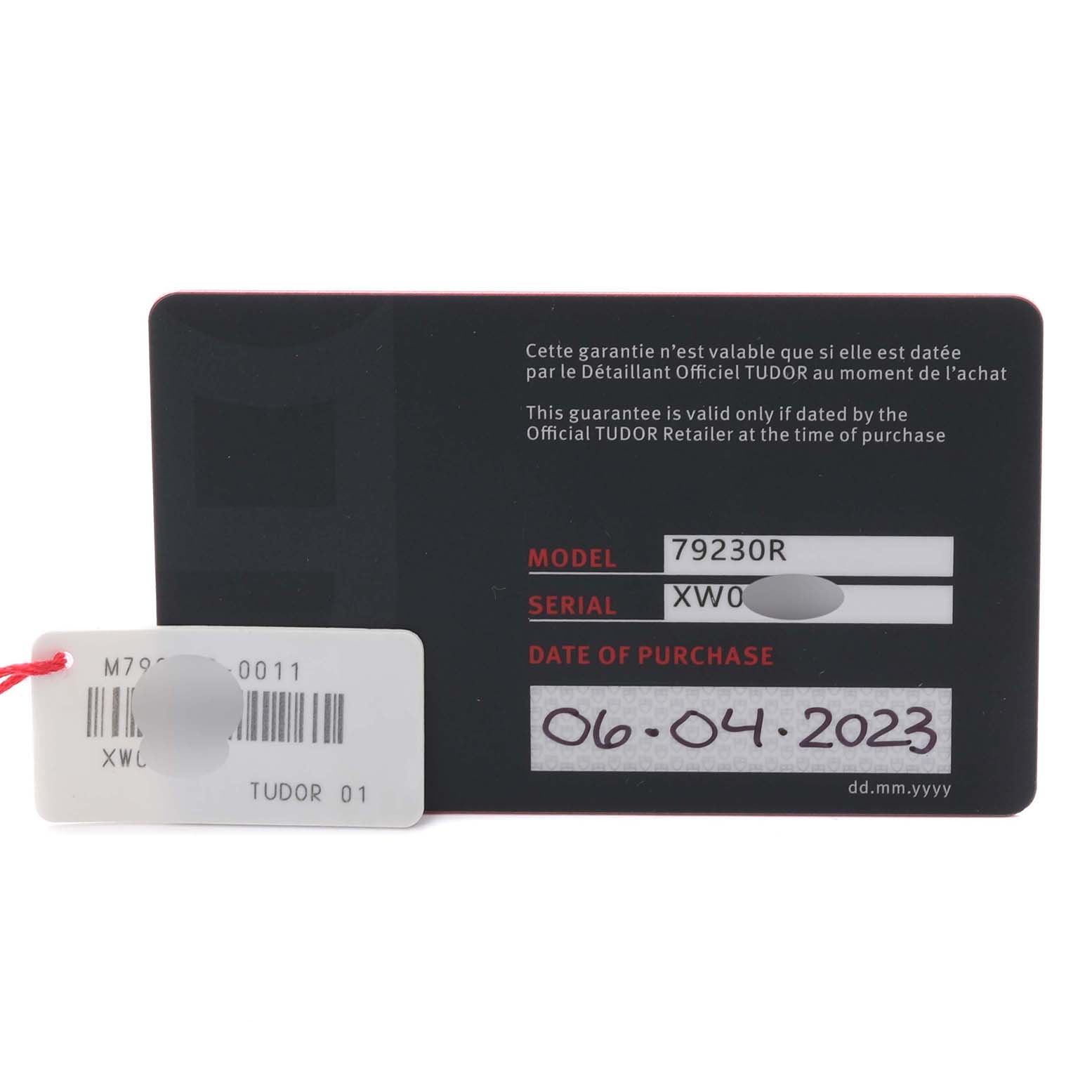 The image shows the warranty card and tag for the Tudor Heritage Black Bay 79230R-0011 Men's Stainless Steel Black Dial 79230R-0011 Men's Stainless Steel Black Dial model 79230R.