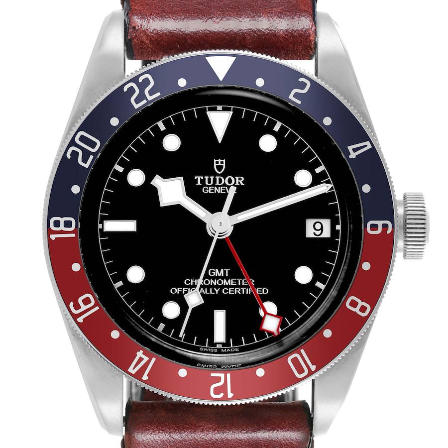 The Tudor Heritage Black Bay watch is shown from the front, displaying the bezel, dial, hands, and case with a leather strap.