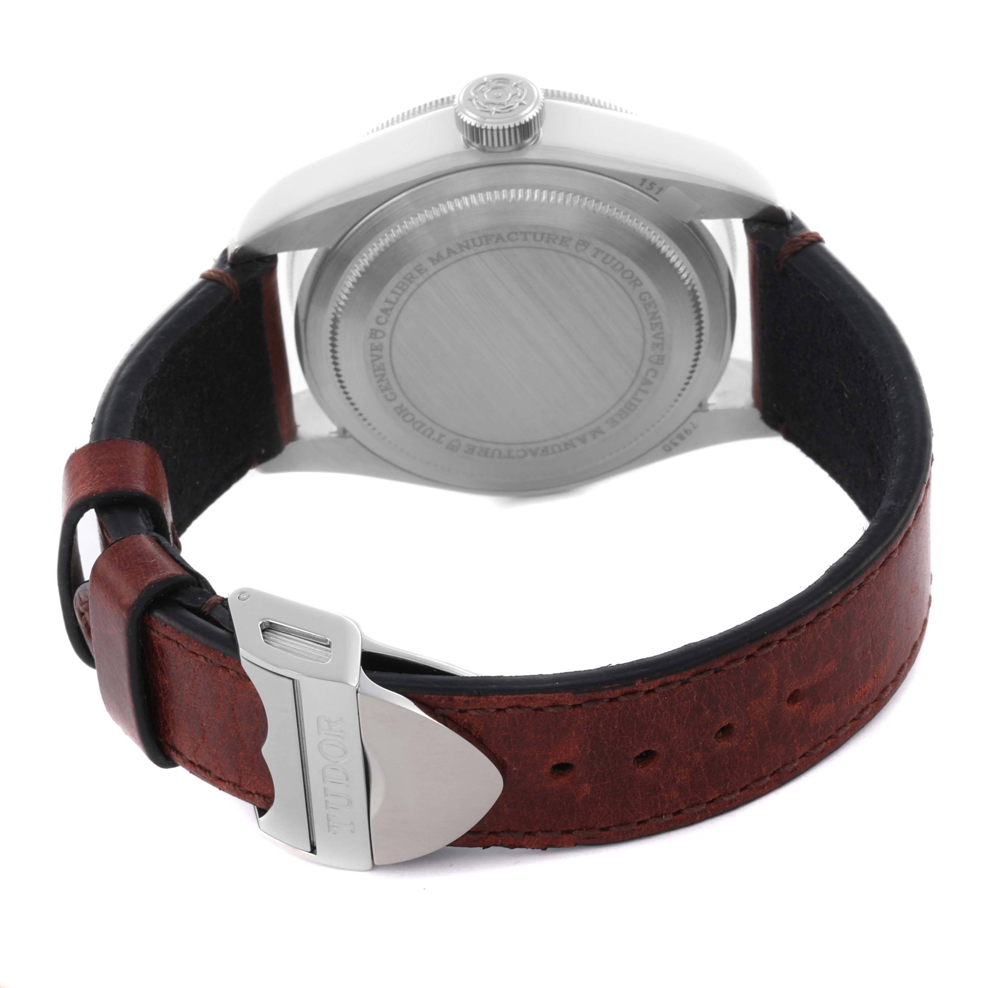 The image shows the back of a Tudor Heritage Black Bay 79830RB-0003 Men's Stainless Steel Black Dial 79830RB-0003 Men's Stainless Steel Black Dial watch, highlighting the case back, crown, and brown leather strap.