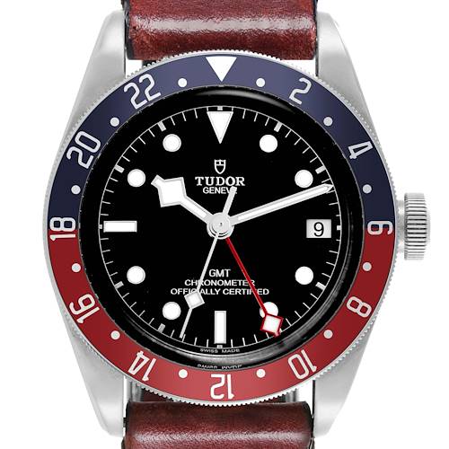 The Tudor Heritage Black Bay watch is shown from a front angle, highlighting its dial, bezel, crown, and strap.
