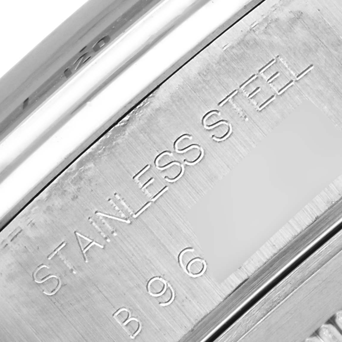 The image shows a close-up of the stainless steel back of a Tudor Prince watch, highlighting engraved details.
