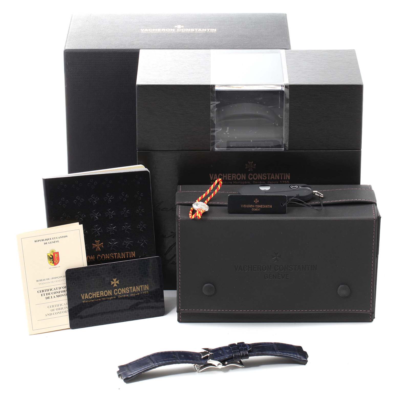 The image shows a Vacheron Constantin Overseas 5500V/110A-B148 Men's Stainless Steel Blue Dial 5500V/110A-B148 Men's Stainless Steel Blue Dial watch box set, including the box, certificate, manuals, and an additional strap.