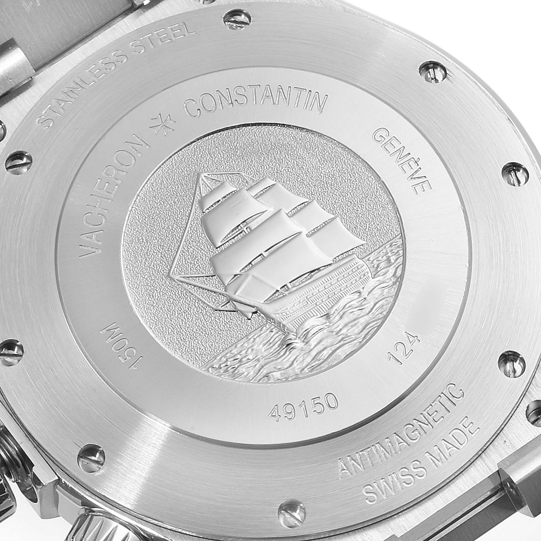 The image shows the back of the Vacheron Constantin Overseas 49150.B01A.9097 Men's Stainless Steel Blue Dial 49150.B01A.9097 Men's Stainless Steel Blue Dial watch featuring an engraved ship.