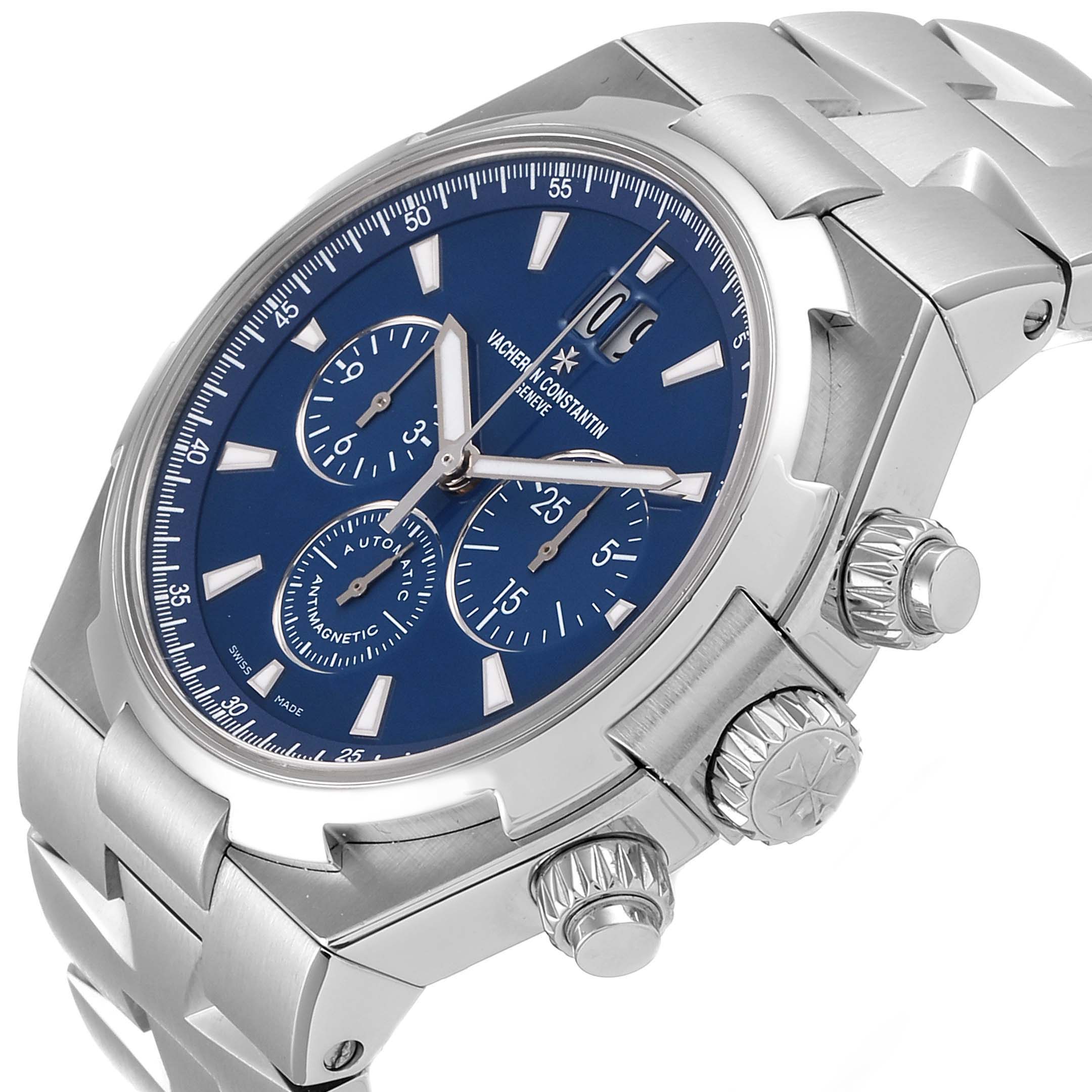 The image shows a Vacheron Constantin Overseas 49150.B01A.9097 Men's Stainless Steel Blue Dial 49150.B01A.9097 Men's Stainless Steel Blue Dial watch from a front-side angle, highlighting the dial, crown, and pushers.
