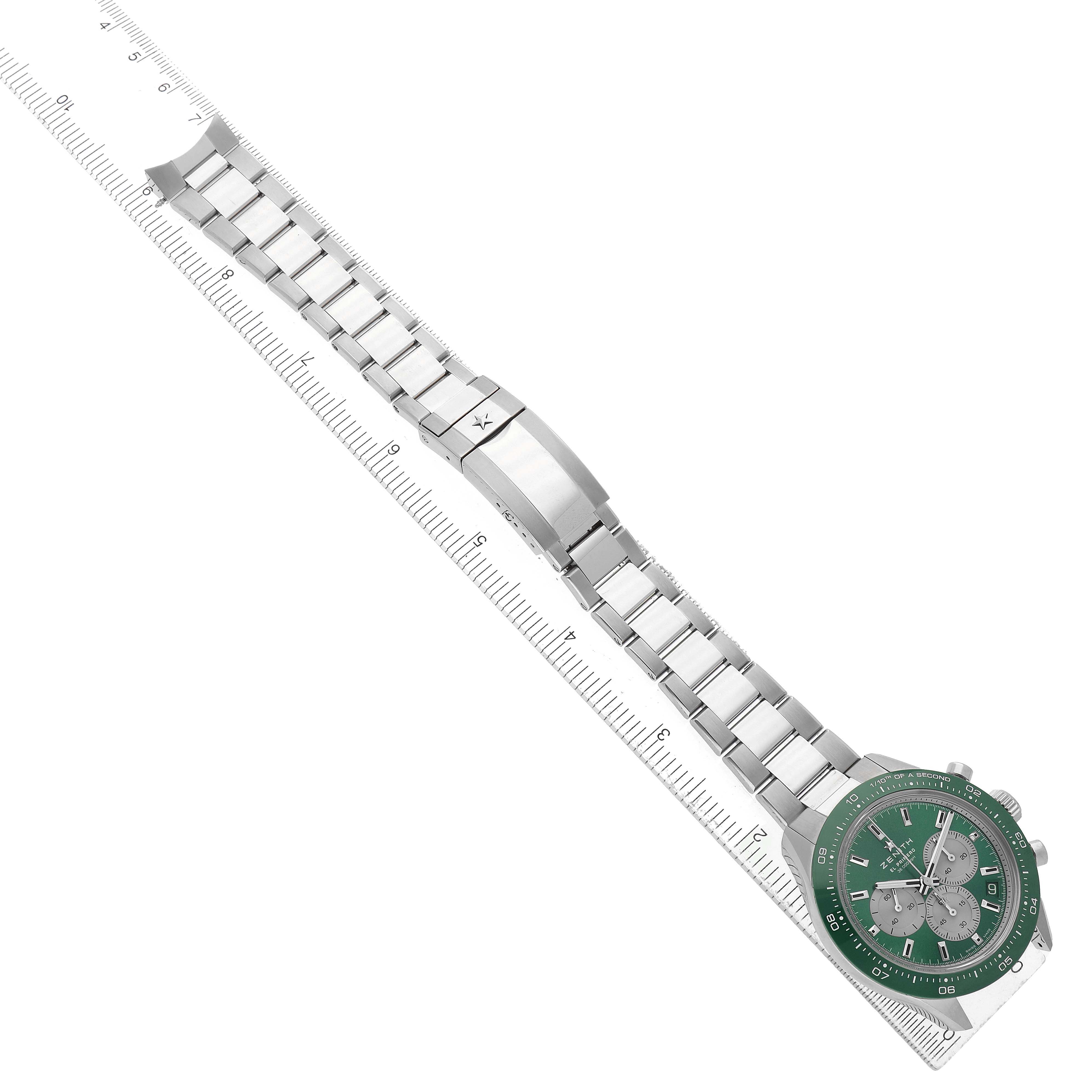 The Zenith Chronomaster 03.3108.3600/57.M3100 Men's Stainless Steel Green Dial watch is shown from a top-down angle, featuring the face, bezel, and full metal bracelet displayed alongside a ruler.