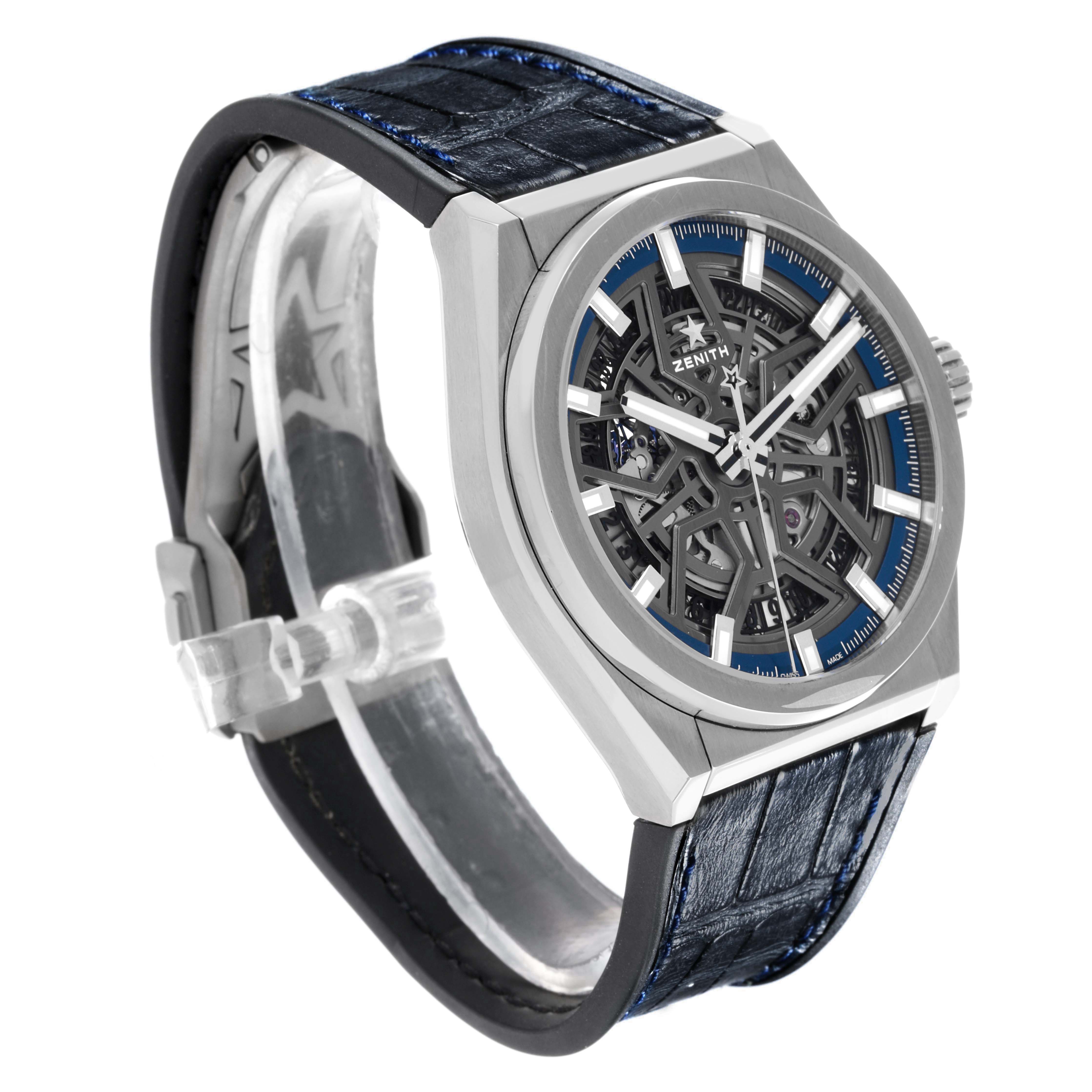The Zenith Defy 95.9000.670 Men
s Stainless Steel Grey Dial 95.9000.670 Men
s Stainless Steel Grey Dial watch is shown at a three-quarter angle, highlighting its skeleton dial and leather strap.