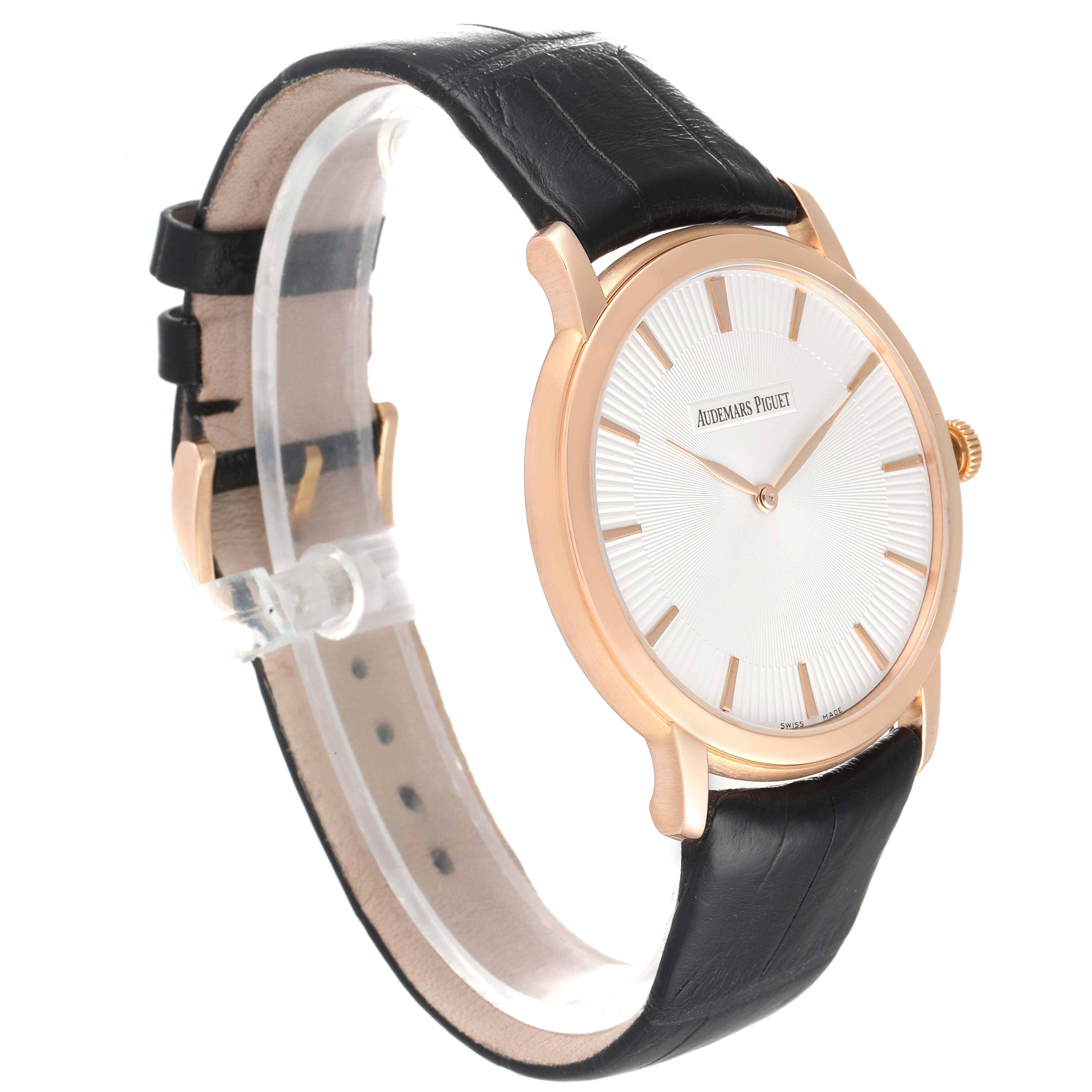 The image shows a side view of an Audemars Piguet Jules 15180OR.OO.A102CR.01 Men's Rose Gold Silver Dial 15180OR.OO.A102CR.01 Men's Rose Gold Silver Dial watch featuring a black leather strap and a gold case.