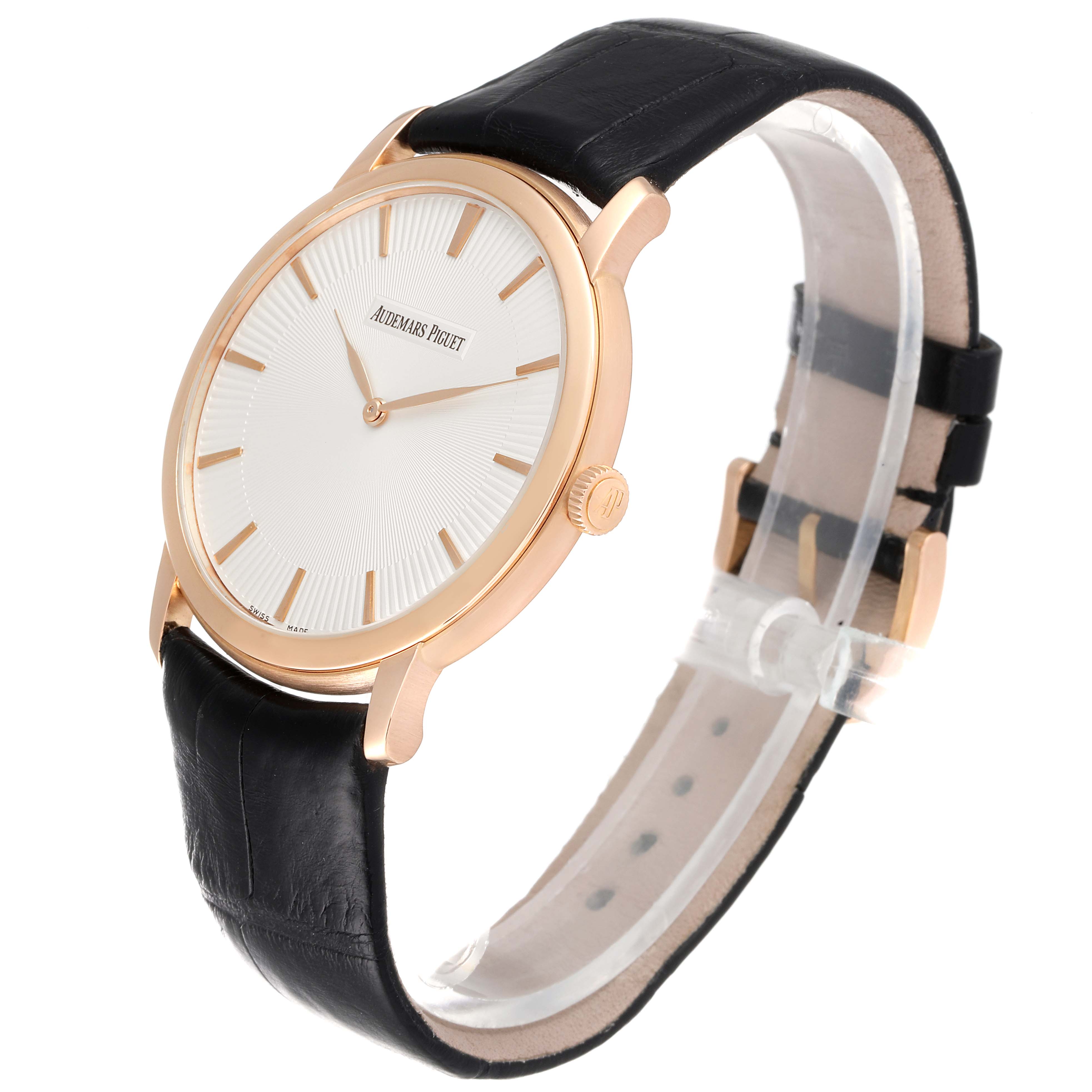 The image shows a side angle of an Audemars Piguet Jules 15180OR.OO.A102CR.01 Men's Rose Gold Silver Dial 15180OR.OO.A102CR.01 Men's Rose Gold Silver Dial watch, displaying its face, strap, and crown.